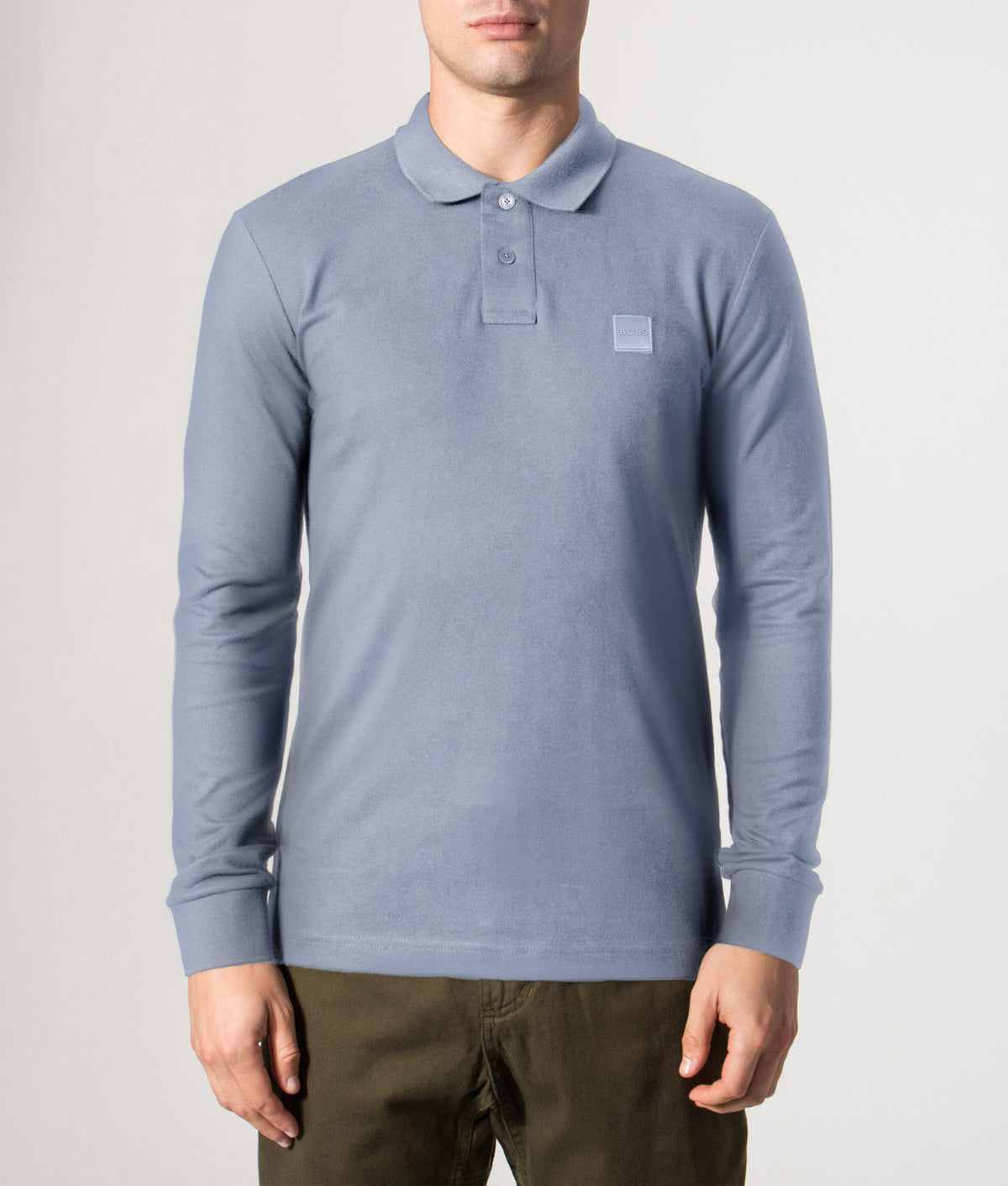 BOSS Slim Fit Passerby Long Sleeve Polo Shirt in Medium Blue at EQVVS Menswear. Front model shot.