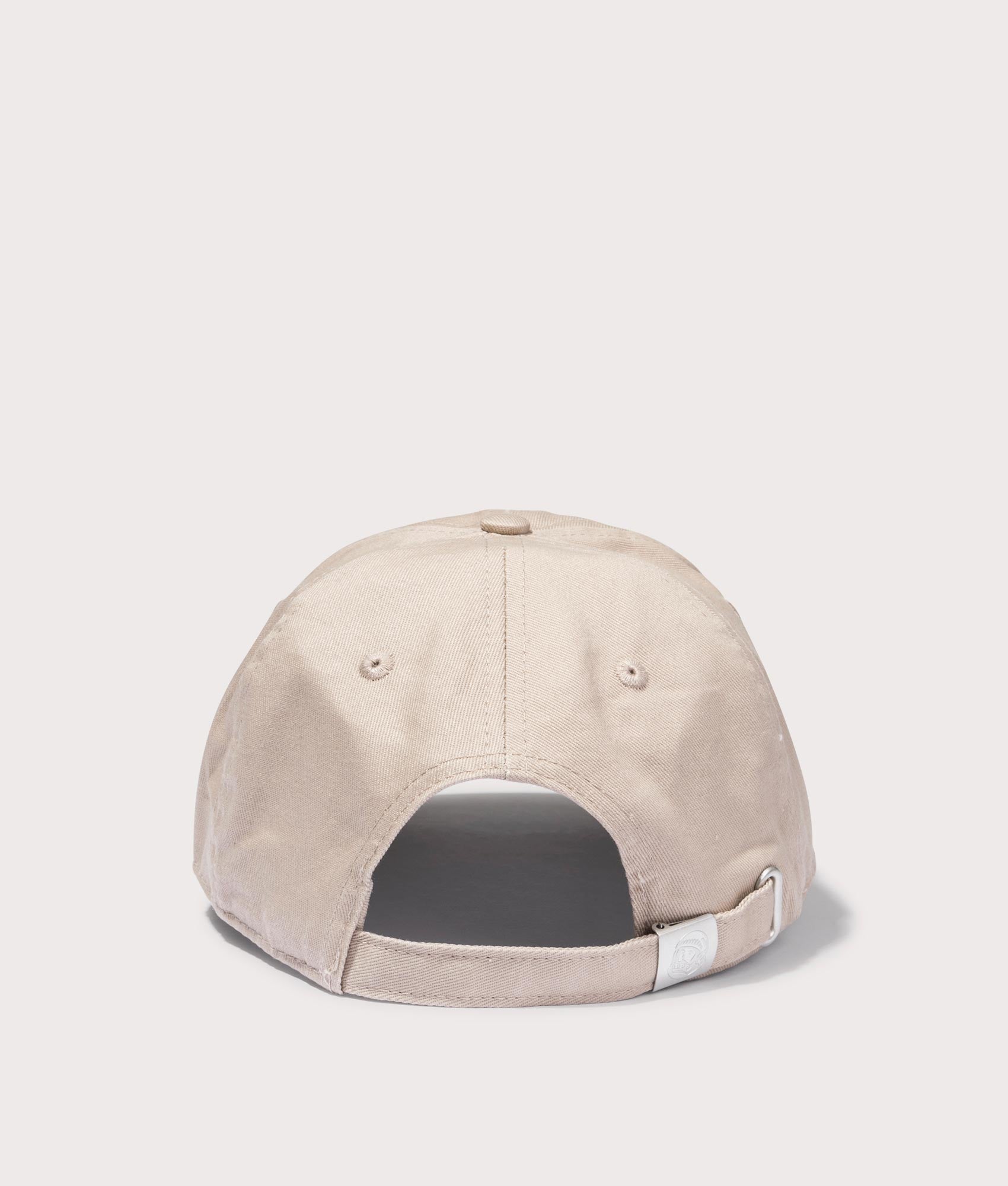 Astro Logo Curved Visor Cap in Beige by Billionaires Boy Club. EQVVS Back Angle Shot.