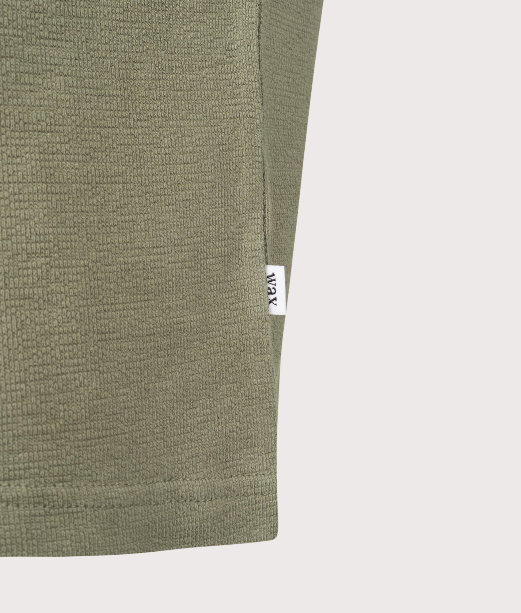 Wax London Dean Short Sleeve T-Shirt in Green at EQVVS Menswear. Detail shot.