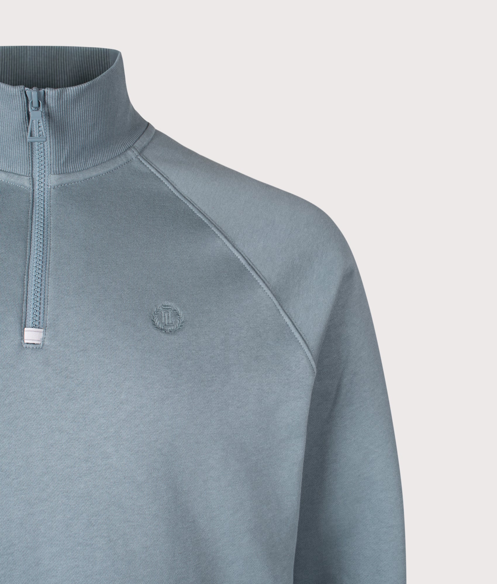 Kinsale Quarter Zip Sweatshirt by Henri Lloyd in Sea Spray Blue. Shot by EQVVS. Detail shot.