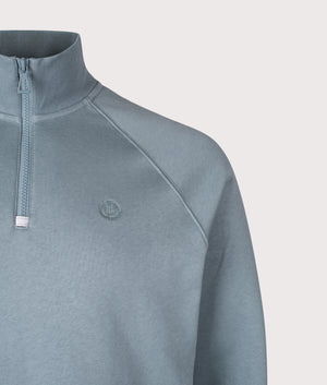 Kinsale Quarter Zip Sweatshirt by Henri Lloyd in Sea Spray Blue. Shot by EQVVS. Detail shot.