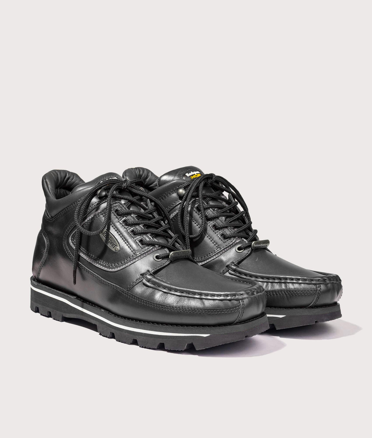 Rockport Umbwe Millennium Anniversary Hiker Boots in Black at EQVVS Menswear. Angled front shot.