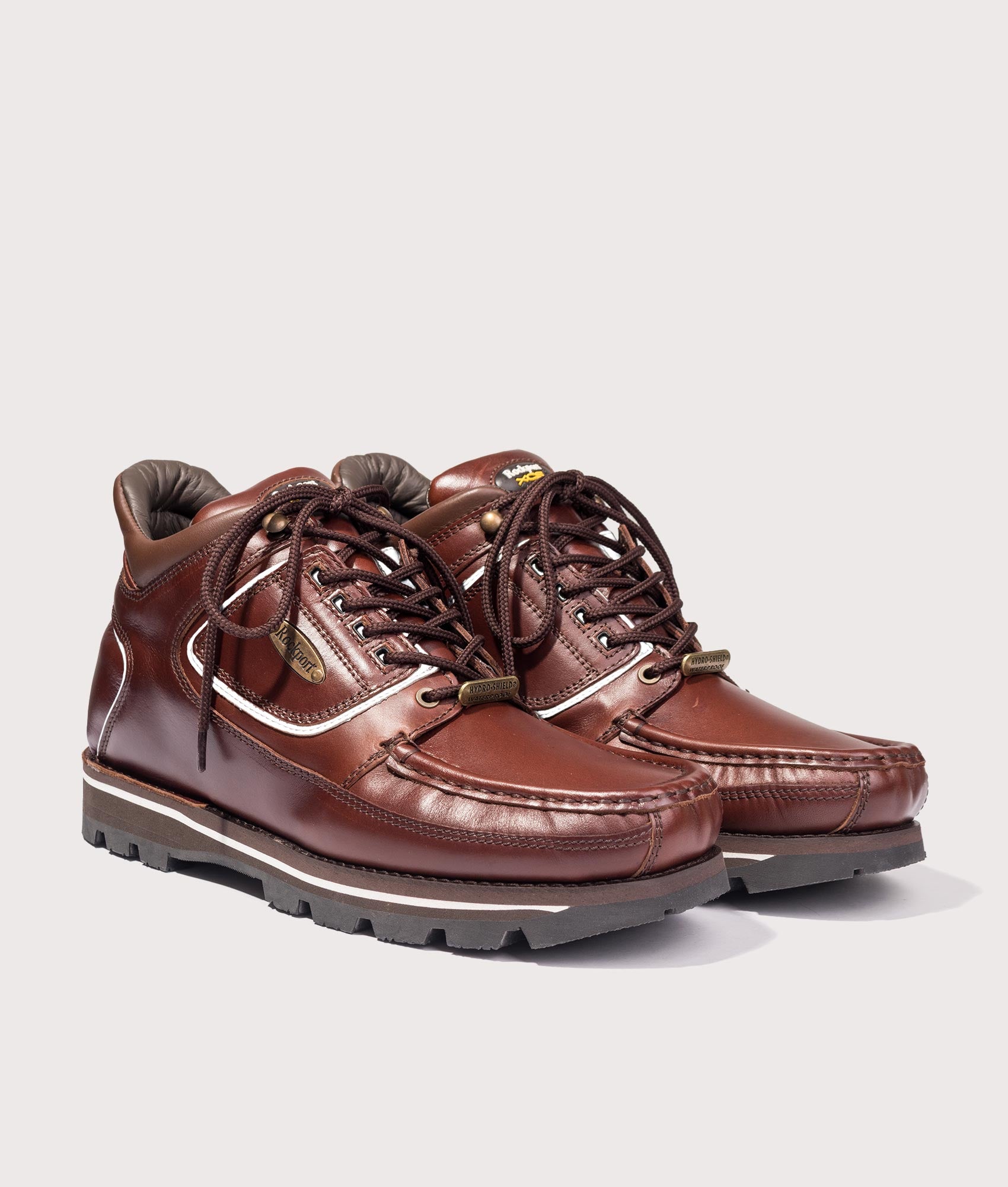 Rockport Umbwe Millennium Anniversary Hiker Boots in Dark Brown at EQVVS Menswear. Angled reflective front shot.