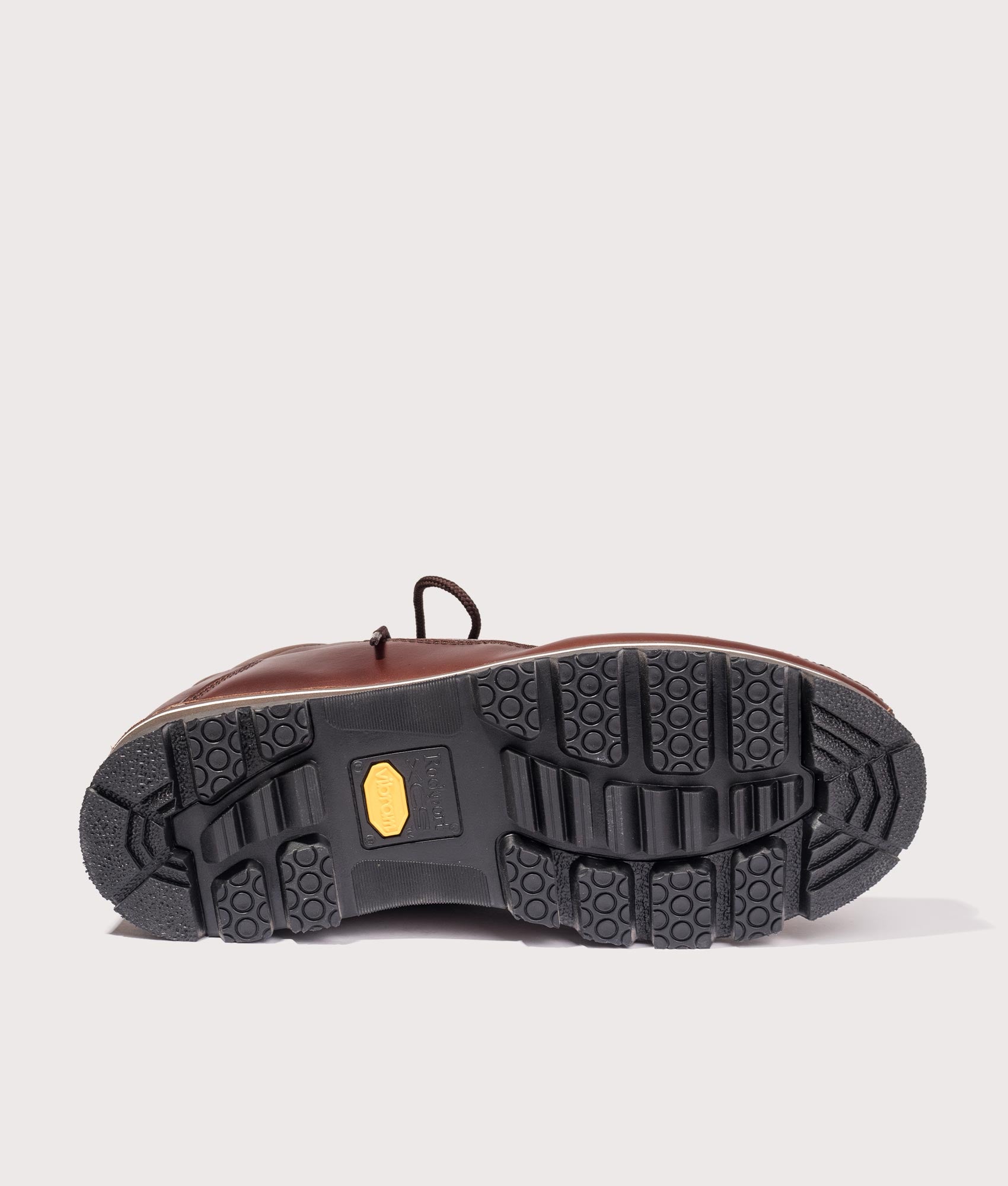 Rockport Umbwe Millennium Anniversary Hiker Boots in Dark Brown at EQVVS Menswear. Tread shot.