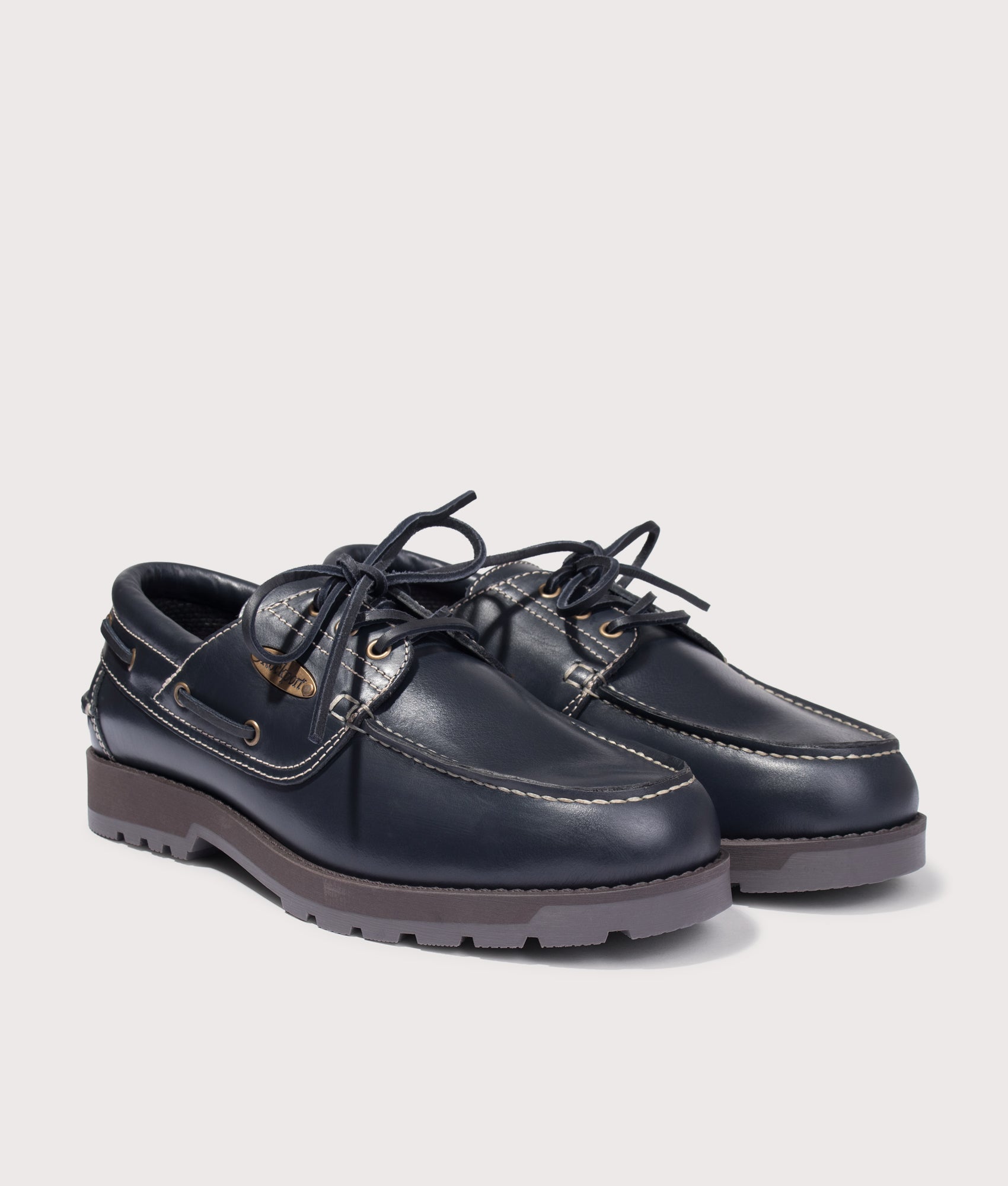 Rockport Country Boat Shoes in Navy at EQVVS Menswear. Angled front shot.