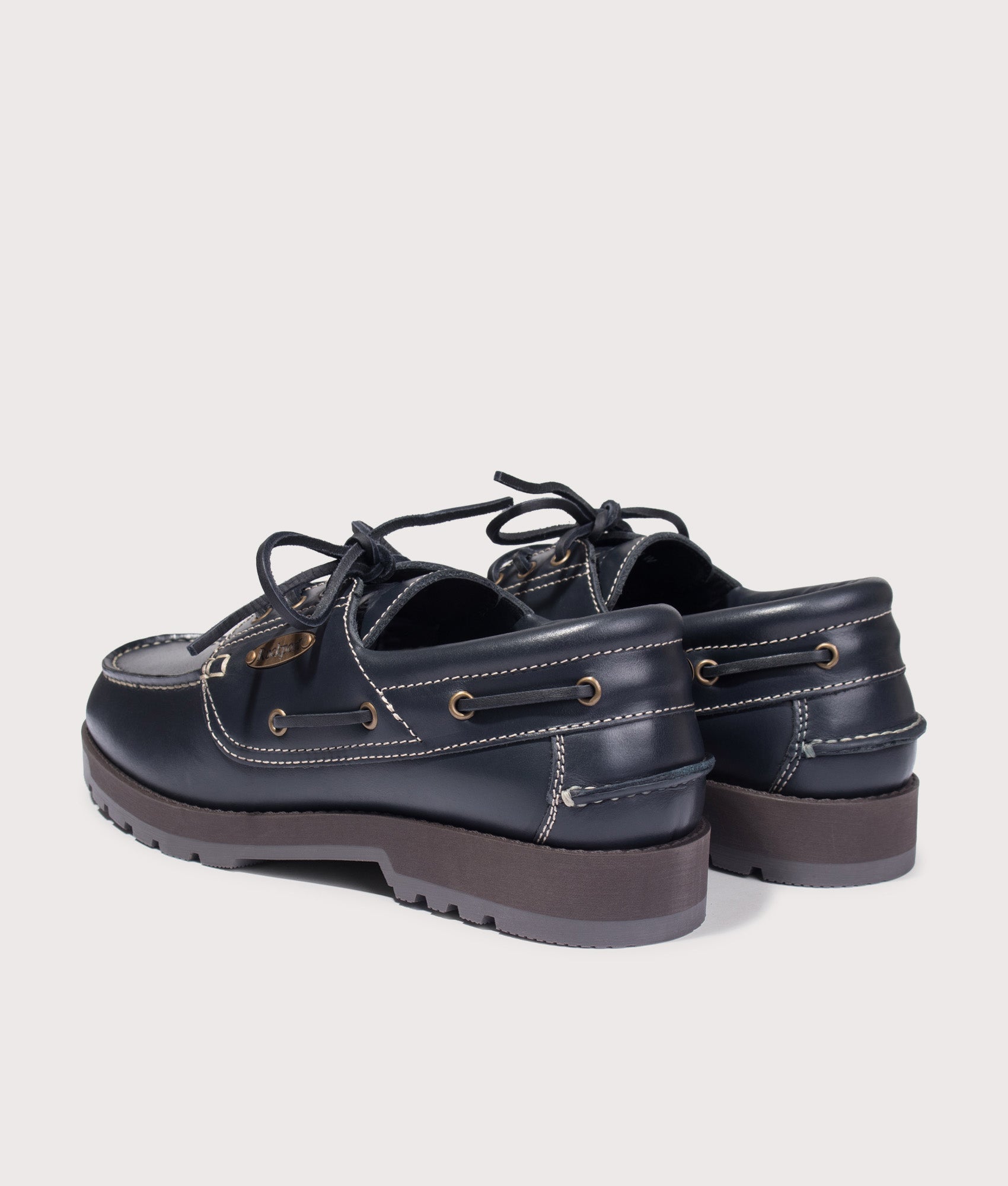 Rockport Country Boat Shoes in Navy at EQVVS Menswear. Angled back shot.