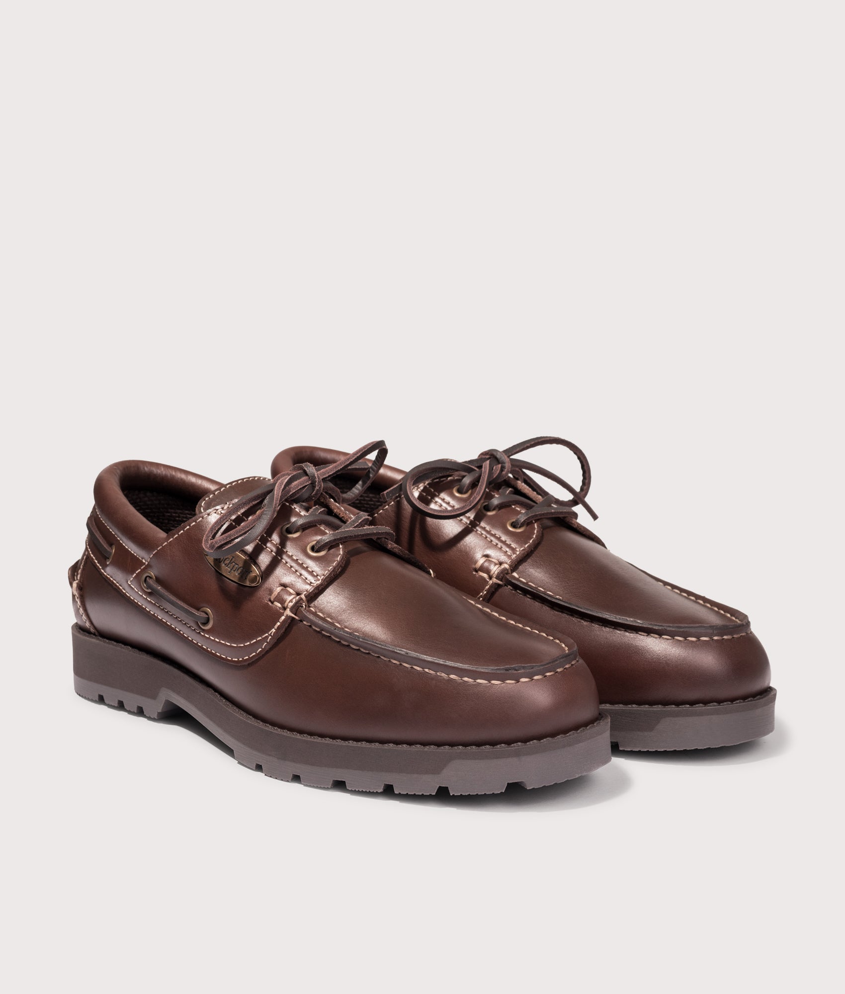 Rockport Country Boat Shoes in Chocolate at EQVVS Menswear. Angled front shot.