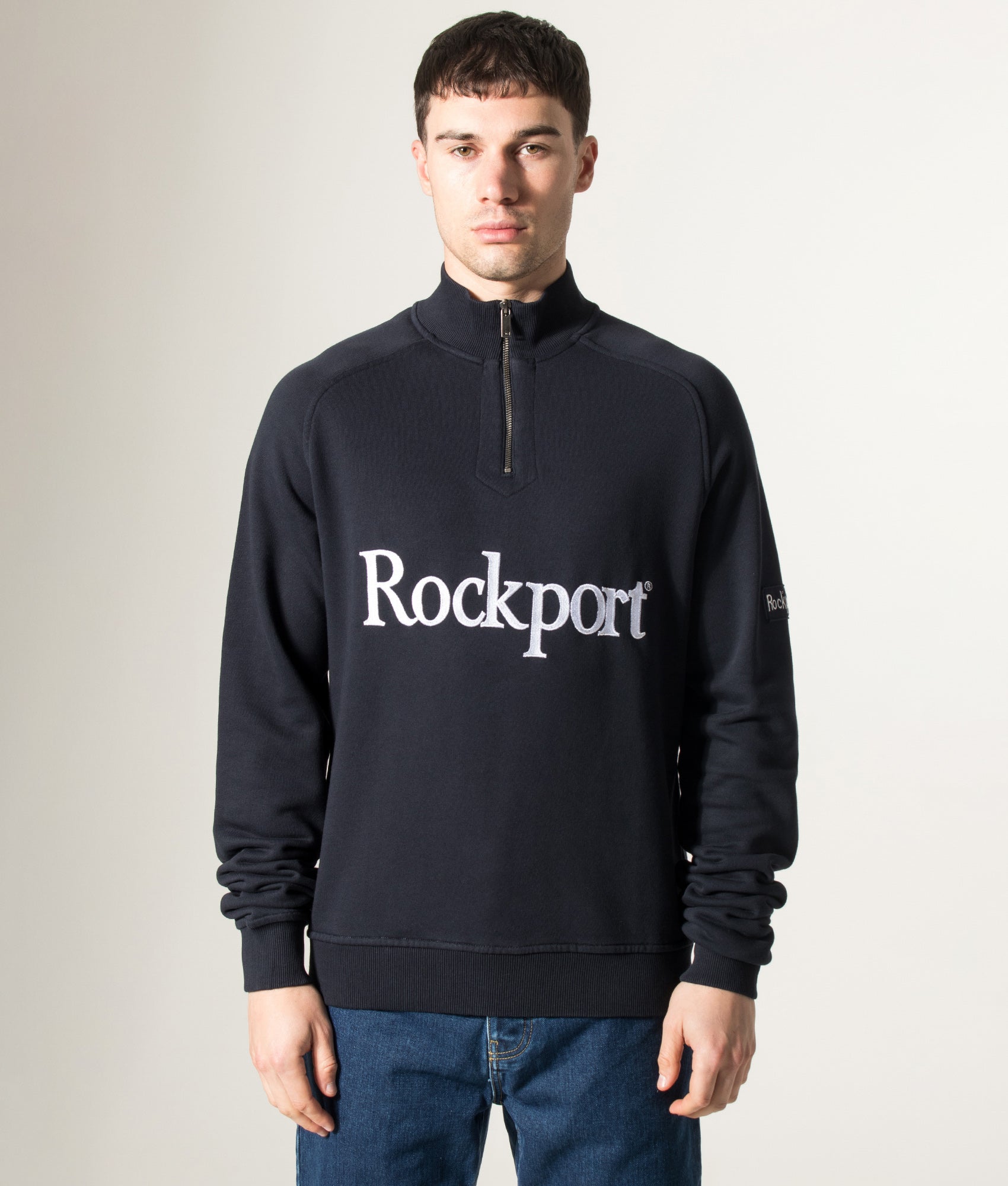 Rockport Relaxed Fit Boston Logo Quarter Zip Sweatshirt in Navy at EQVVS Menswear. Model front shot.