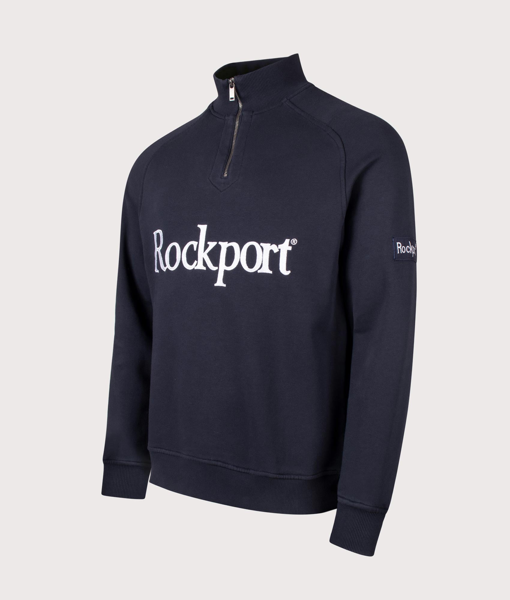 Rockport Relaxed Fit Boston Logo Quarter Zip Sweatshirt in Navy at EQVVS Menswear. Angled front shot.