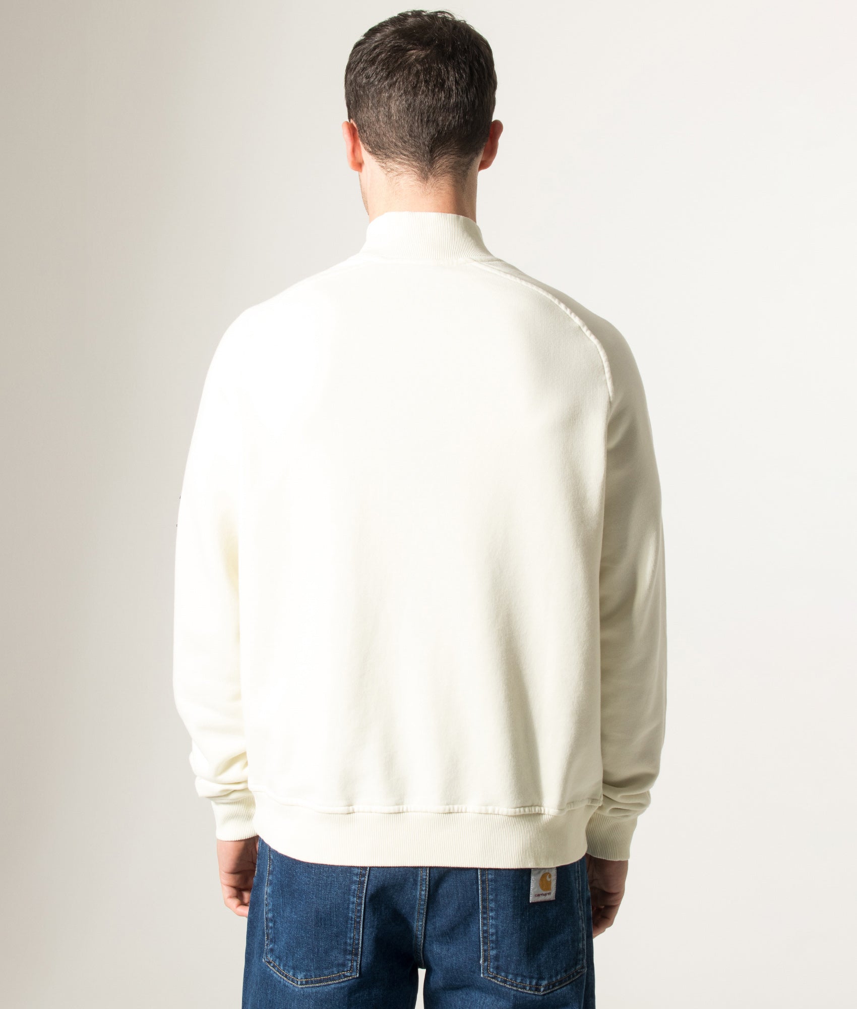 Rockport Relaxed Fit Boston Logo Quarter Zip Sweatshirt in Ecru at EQVVS Menswear. Model back shot.