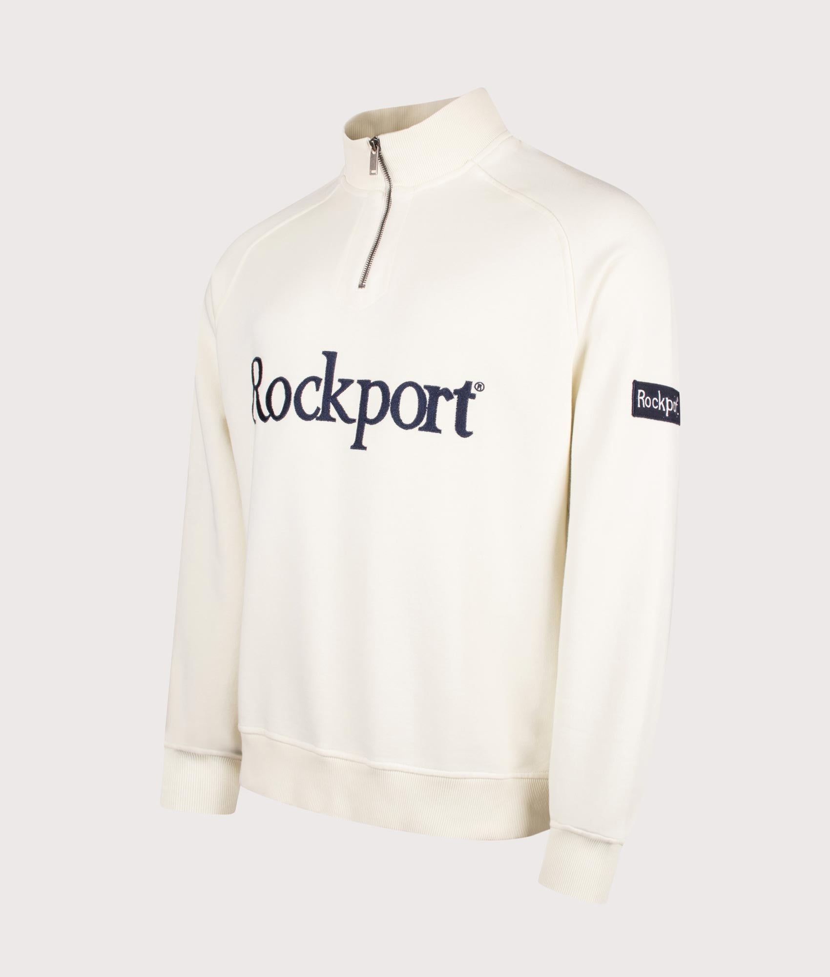 Rockport Relaxed Fit Boston Logo Quarter Zip Sweatshirt in Ecru at EQVVS Menswear. Angled front shot.