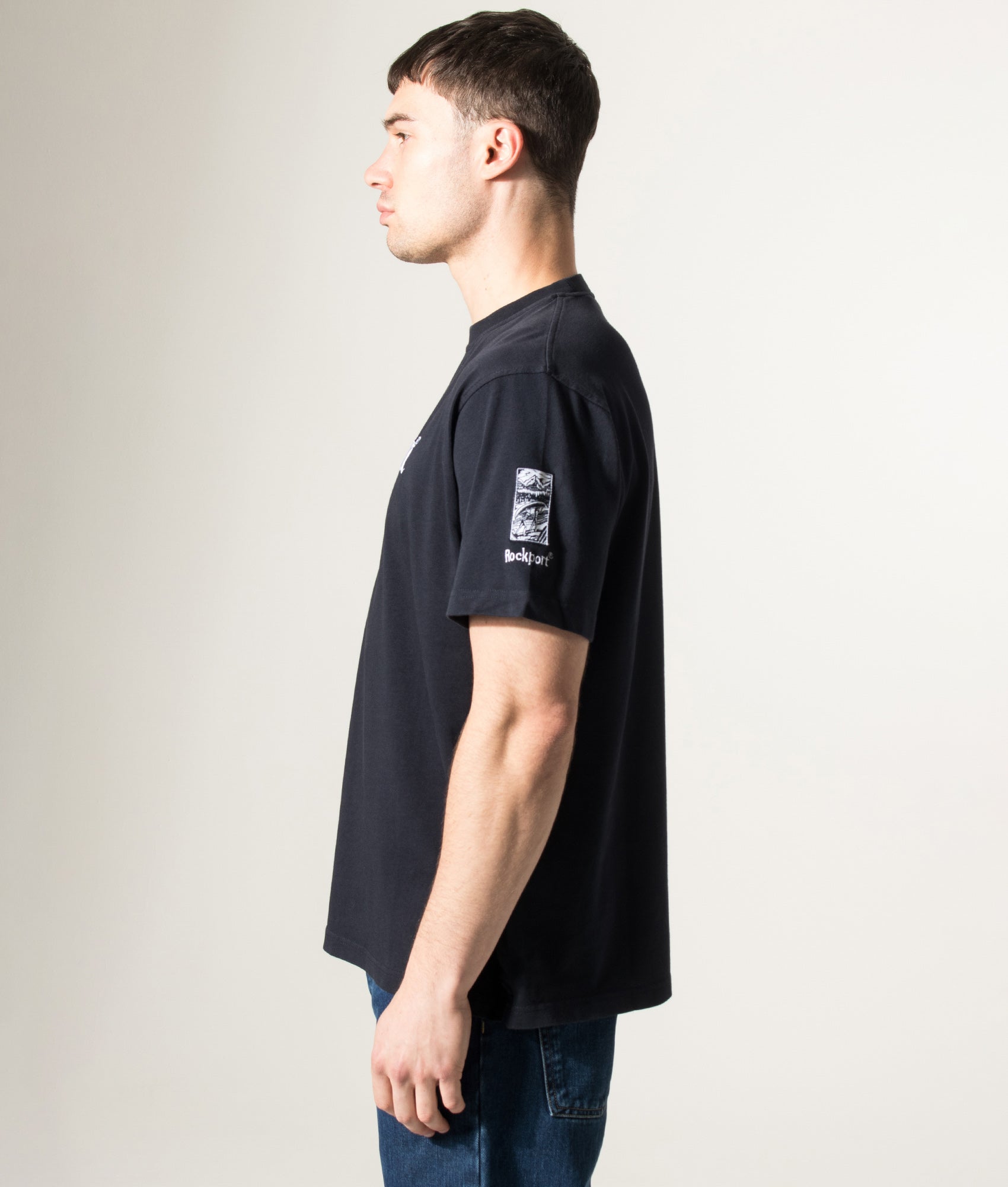 Rockport Relaxed Fit Highland Front Logo Washed T-Shirt in Navy at EQVVS Menswear. Model side shot.