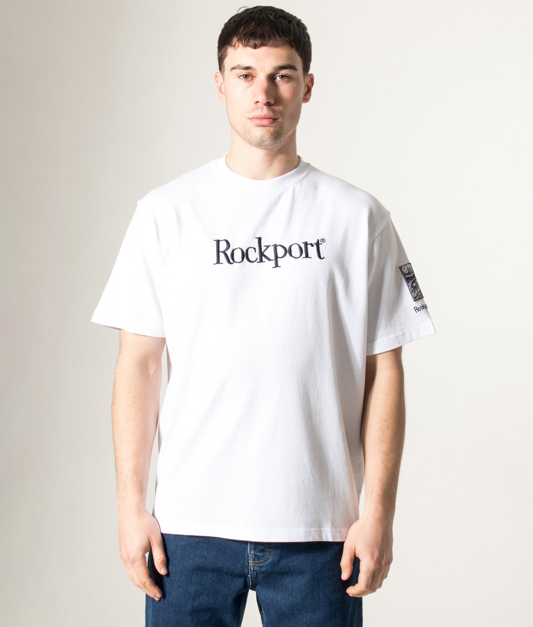 Rockport Relaxed Fit Highland Front Logo Washed T-Shirt in White at EQVVS Menswear. Model front shot.