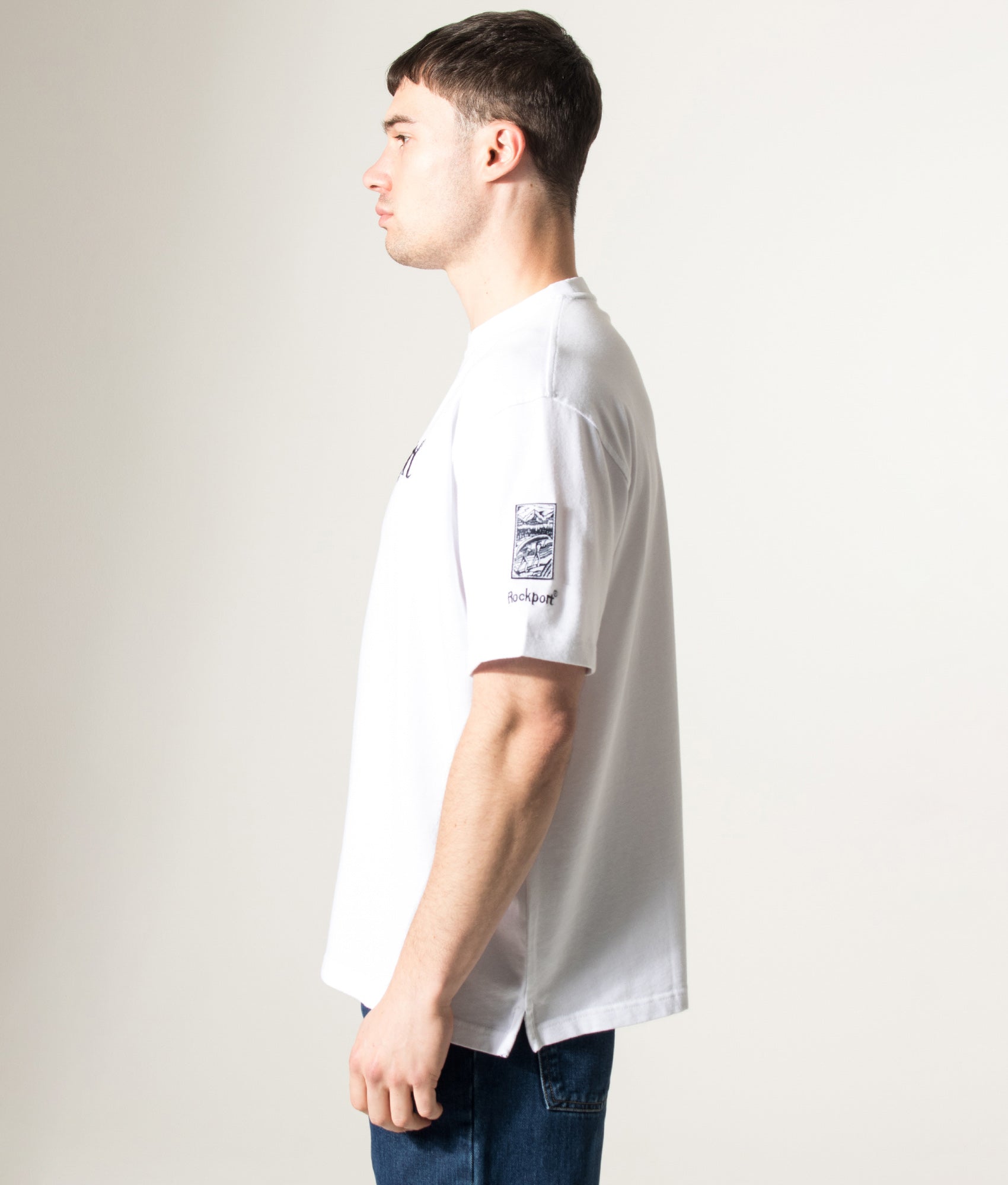 Rockport Relaxed Fit Highland Front Logo Washed T-Shirt in White at EQVVS Menswear. Model front shot.