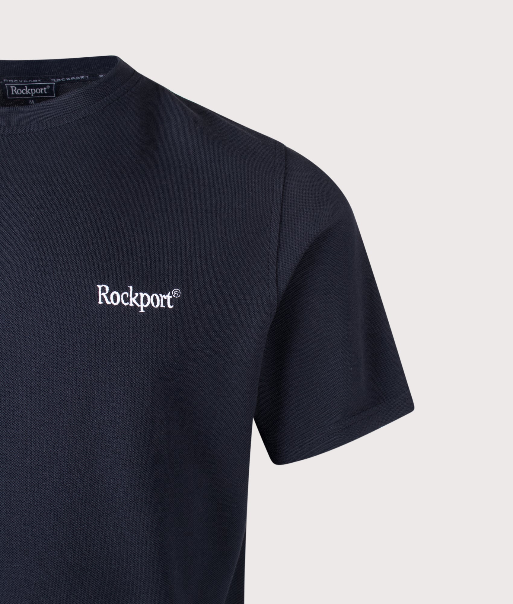 Rockport Relaxed Fit Rocester Piqué Logo T-Shirt in Navy at EQVVS Menswear. Detail shot.