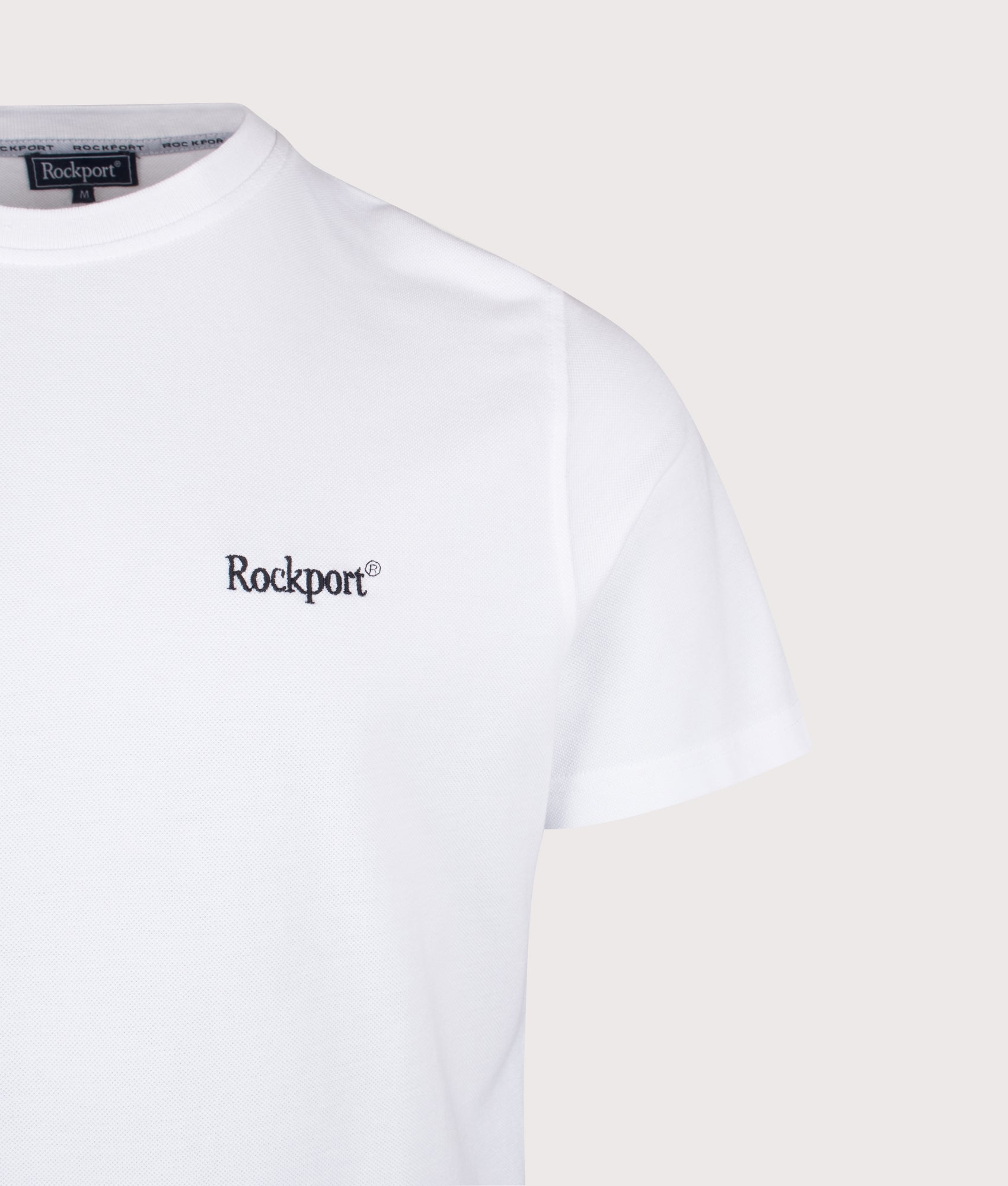 Rockport Relaxed Fit Rocester Piqué Logo T-Shirt in White at EQVVS Menswear. Detail shot.