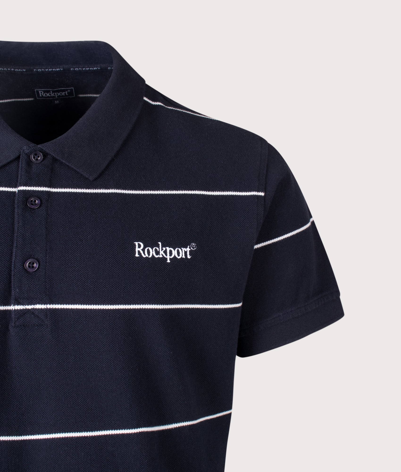 Rockport Relaxed Fit Katz Stripe Polo Shirt in Navy at EQVVS Menswear. Detail shot.