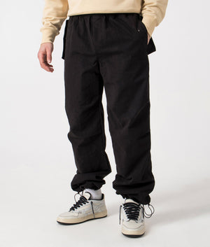 REPRESENT Parachute Pants in black, front shot 2. EQVVS