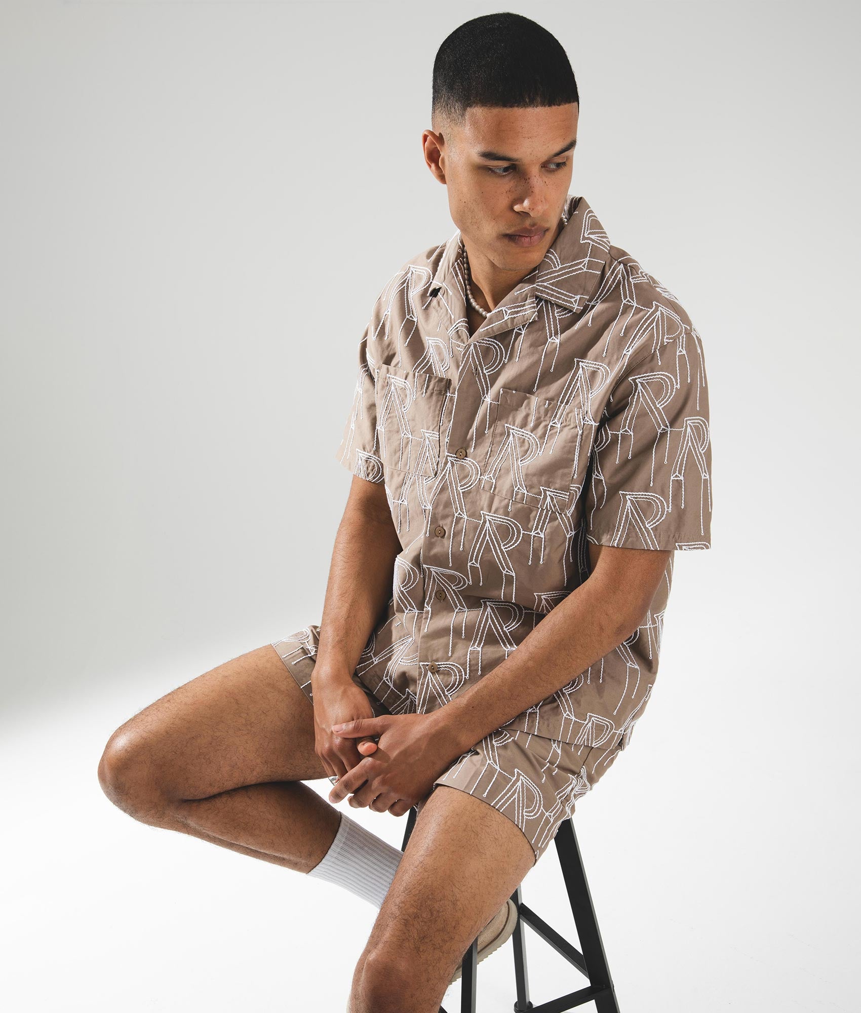 Embroidered Initial Overshirt Washed Taupe REPRESENT EQVVS. Campaign Shot. 