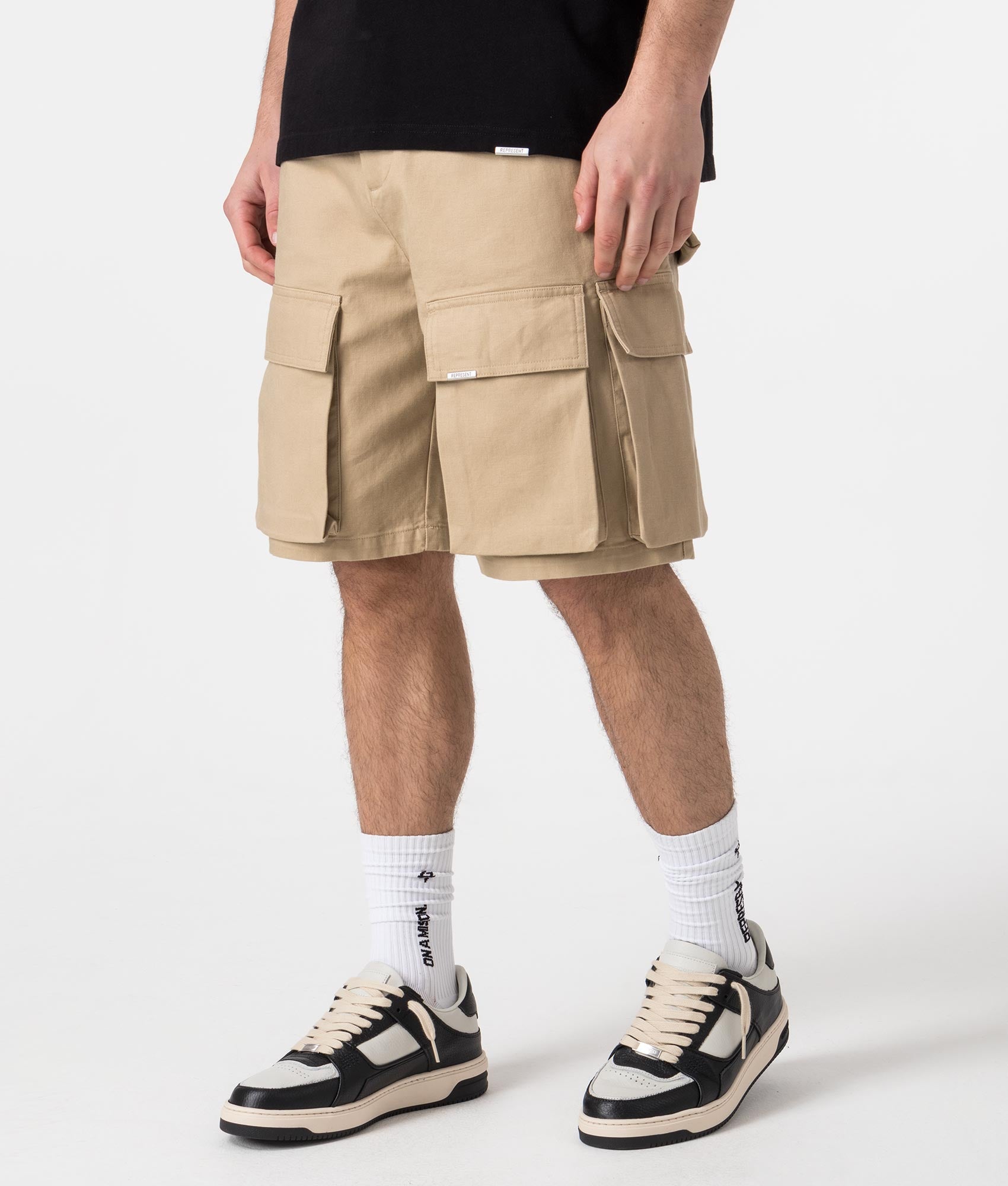 Represent Baggy Cotton Cargo Shorts in sandstone Model Angle shot EQVVS
