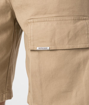 Represent Baggy Cotton Cargo Shorts in sandstone Model Pocket shot EQVVS