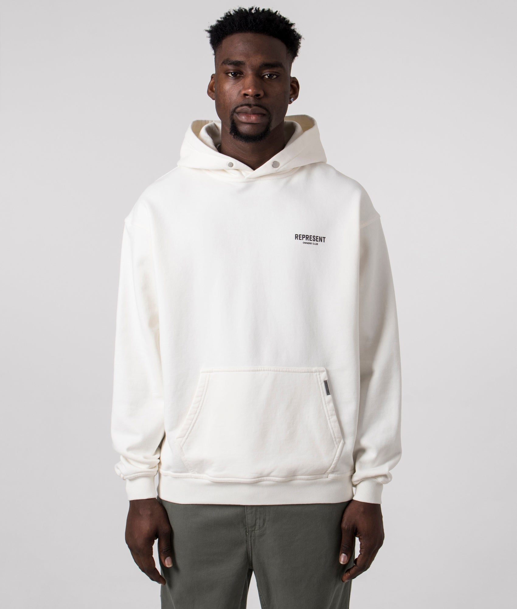 Represent Owners Club Hoodie in Flat White at EQVVS Menswear. Model front shot.