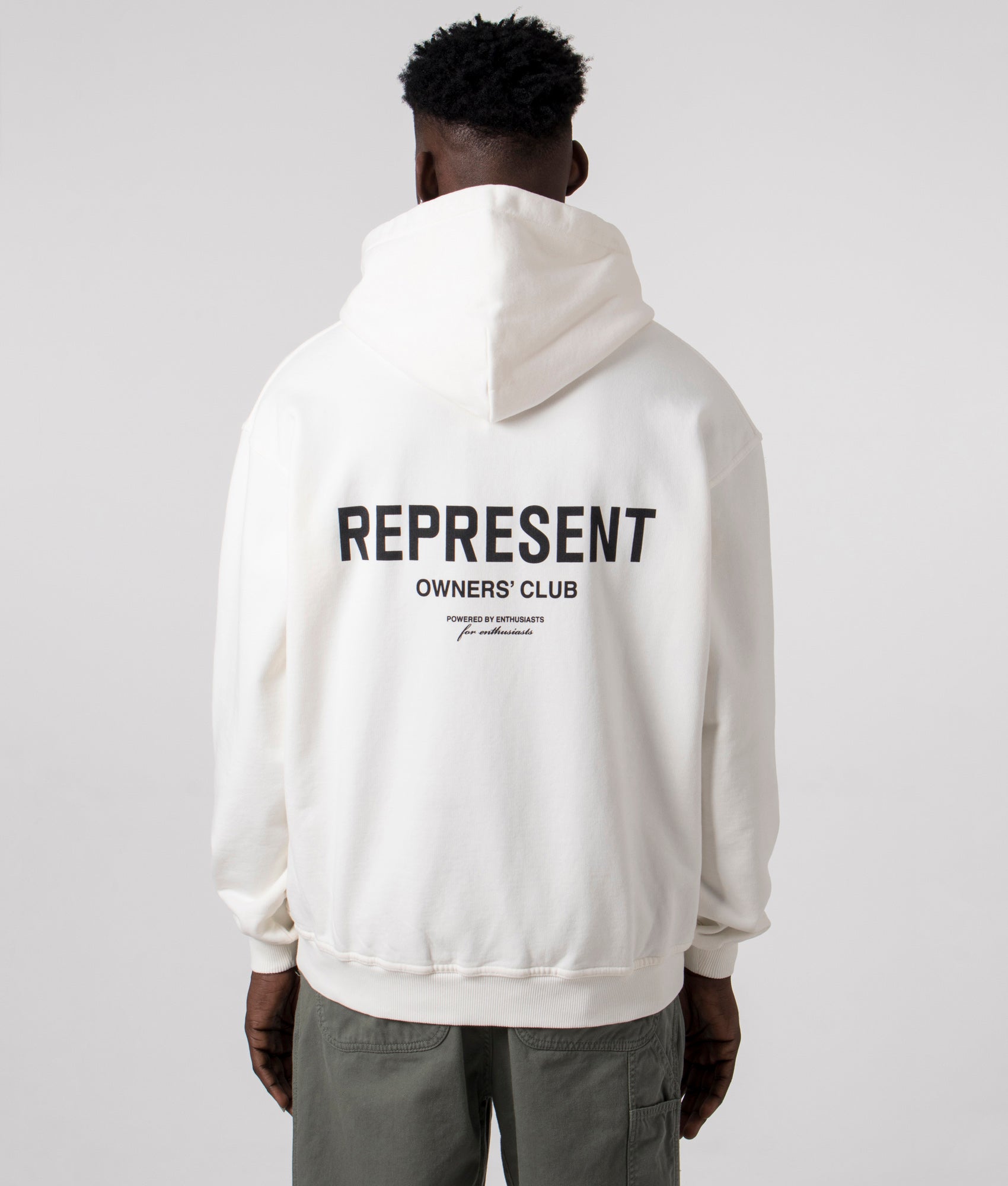 Represent Owners Club Hoodie in Flat White at EQVVS Menswear. Model back shot.