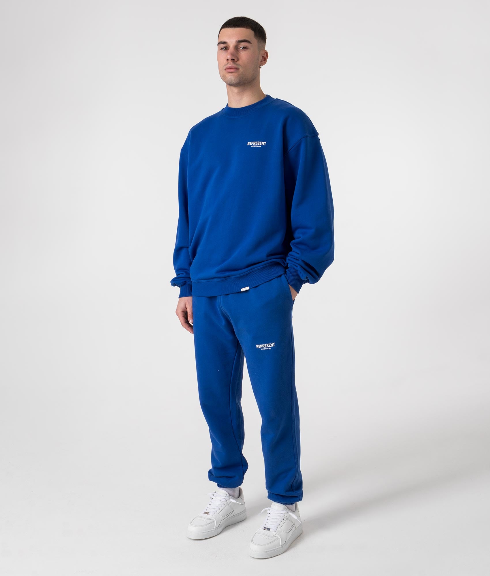 Represent Owners Club Sweatshirt in Cobalt Blue Model Angle Shot EQVVS