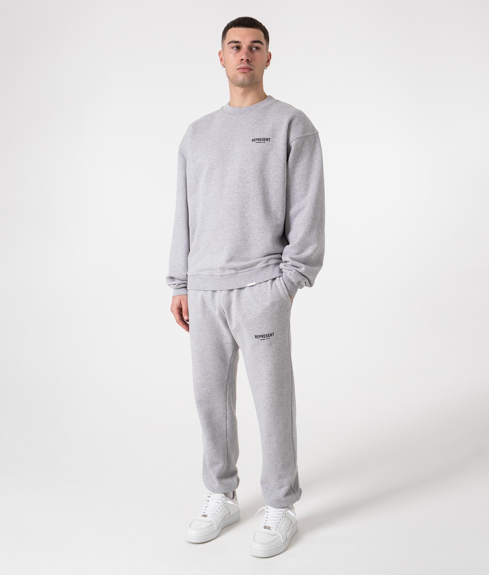 REPRESENT Owners Club Joggers in Ash Grey at EQVVS Menswear. Model full body front shot.