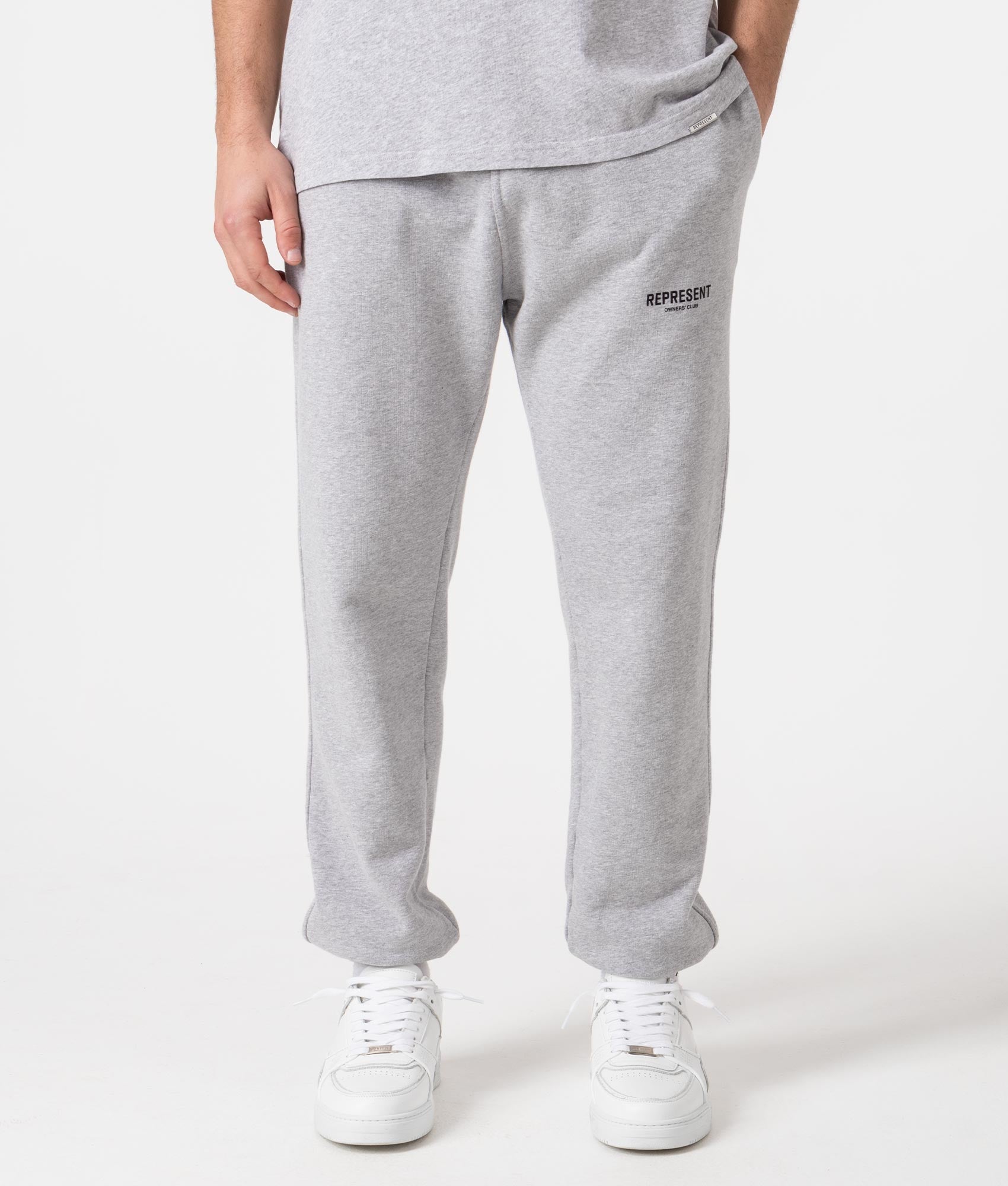 REPRESENT Owners Club Joggers in Ash Grey at EQVVS Menswear. Model front shot.