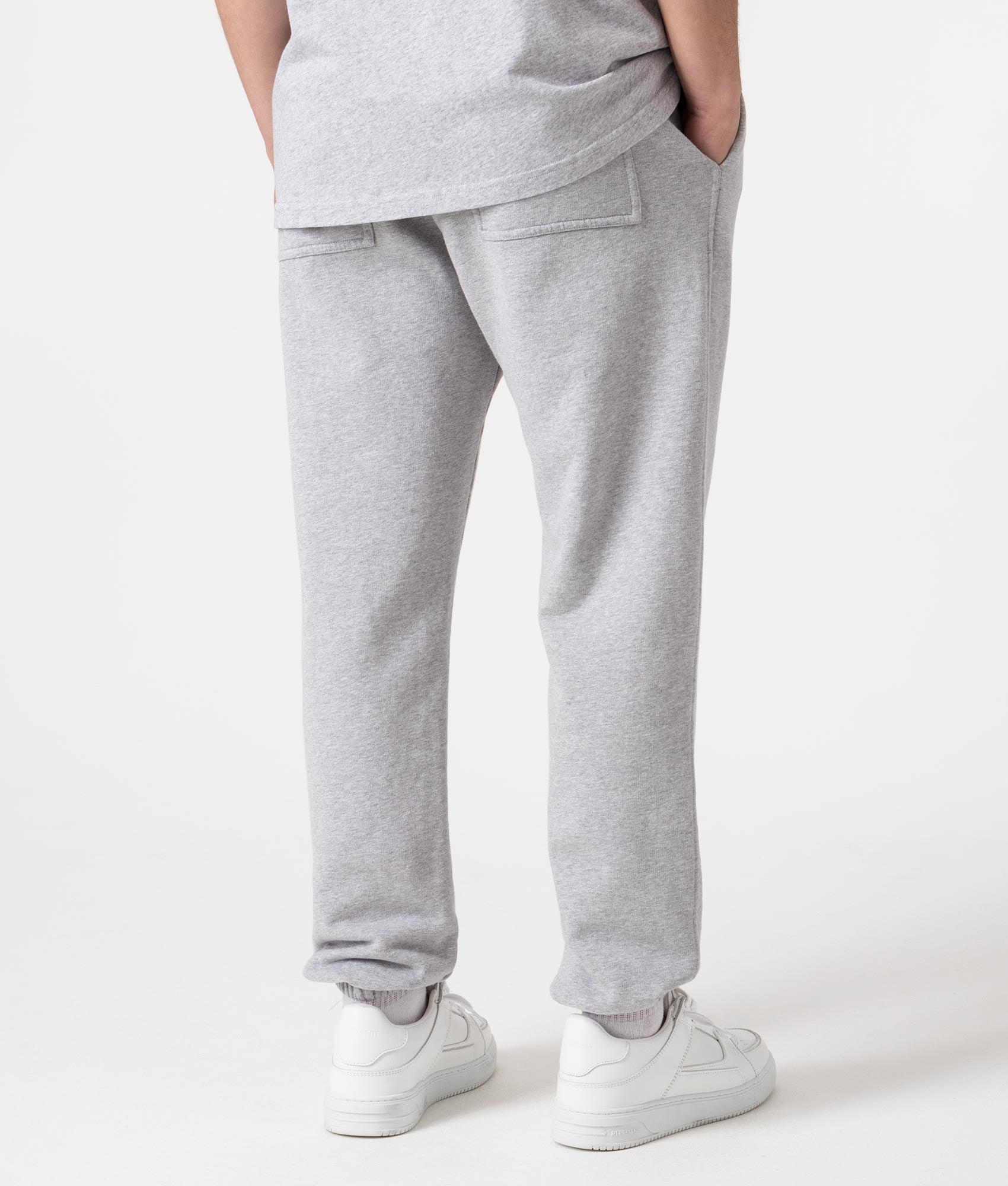 REPRESENT Owners Club Joggers in Ash Grey at EQVVS Menswear. Angled model back shot.