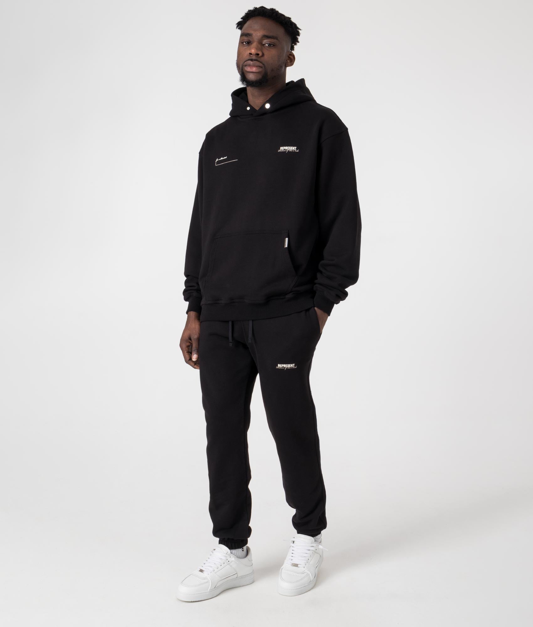 REPRESENT Oversized Patron Of The Club Hoodie in Black at EQVVS Menswear. Model full shot.