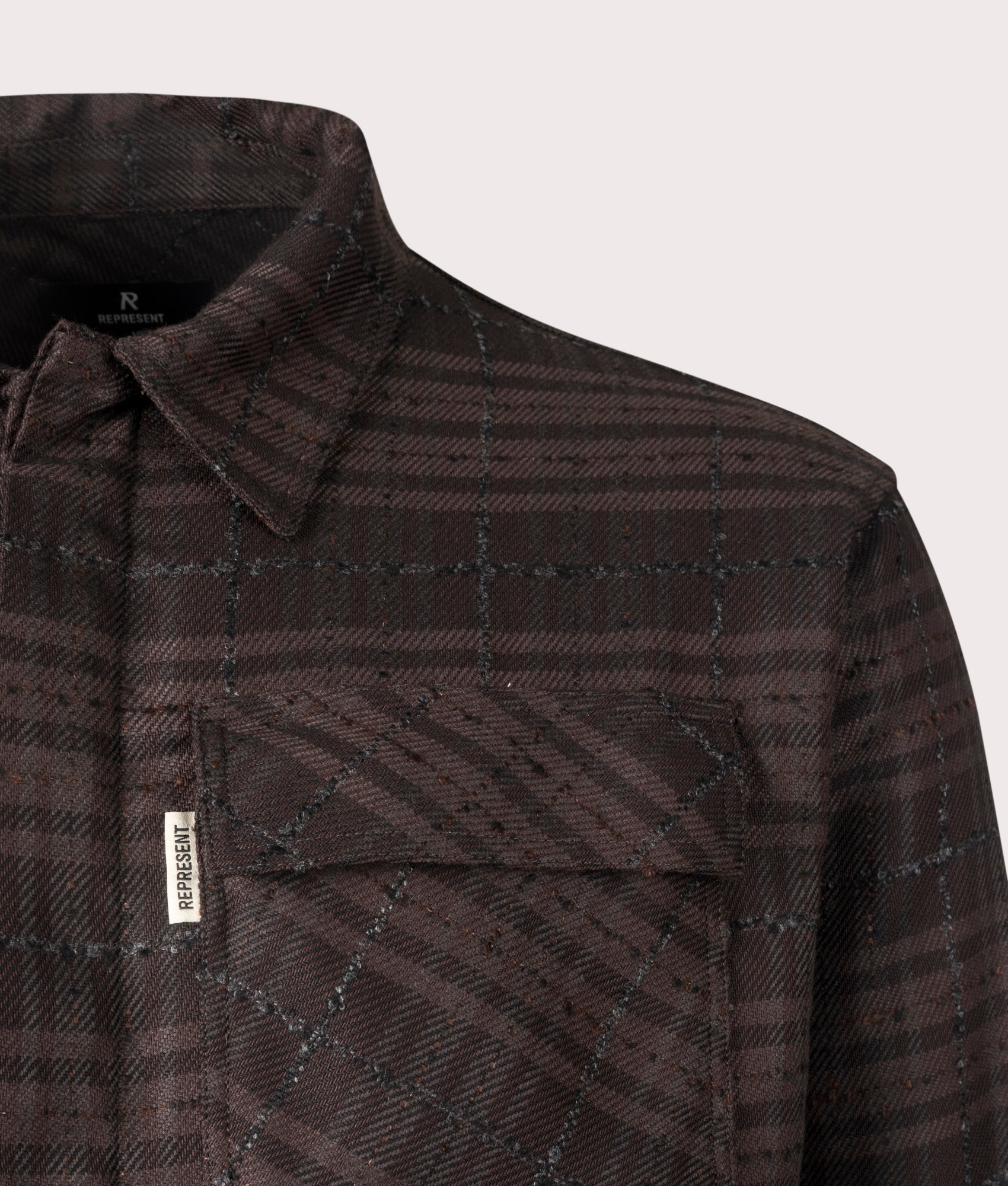 Oversized Rep Flannel Shirt in Coffee from REPRESENT. Detail angle shot at EQVVS.