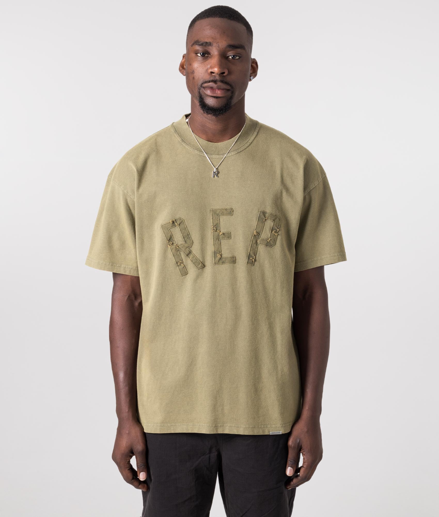 Rep Applique T-Shirt in Fawn by Represent. EQVVS Model Shot. 