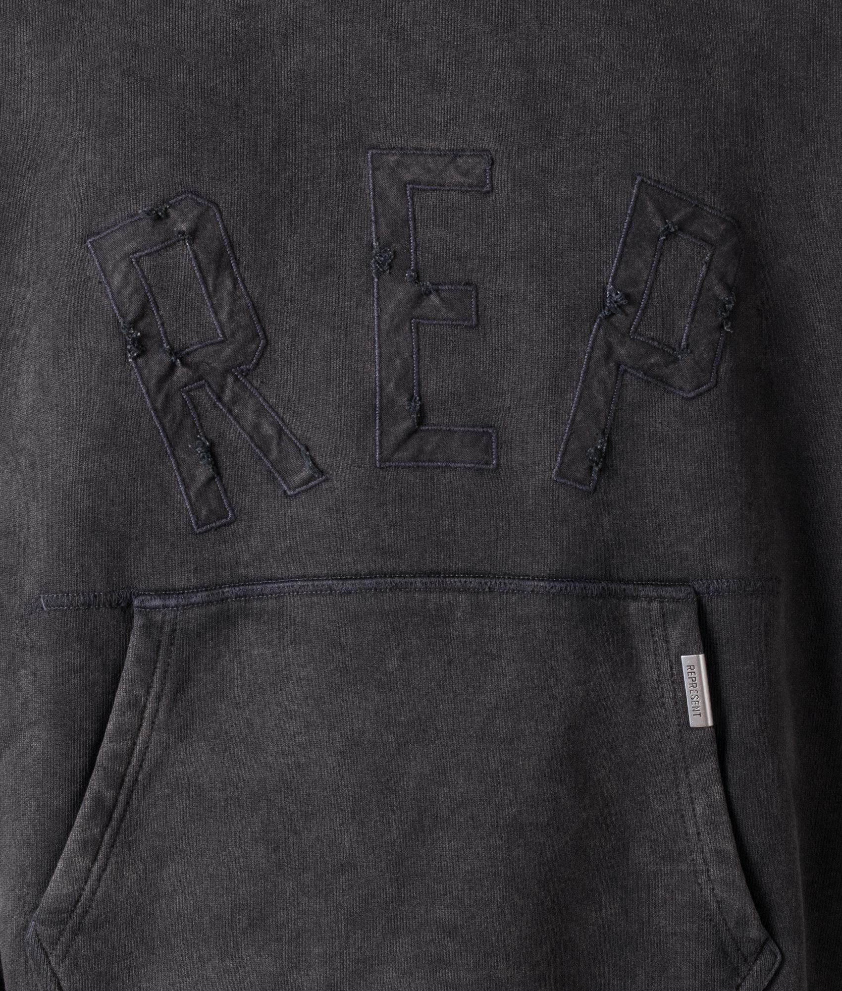 Rep Applique Hoodie in Vintage Black by Represent. EQVVS Model Shot. 