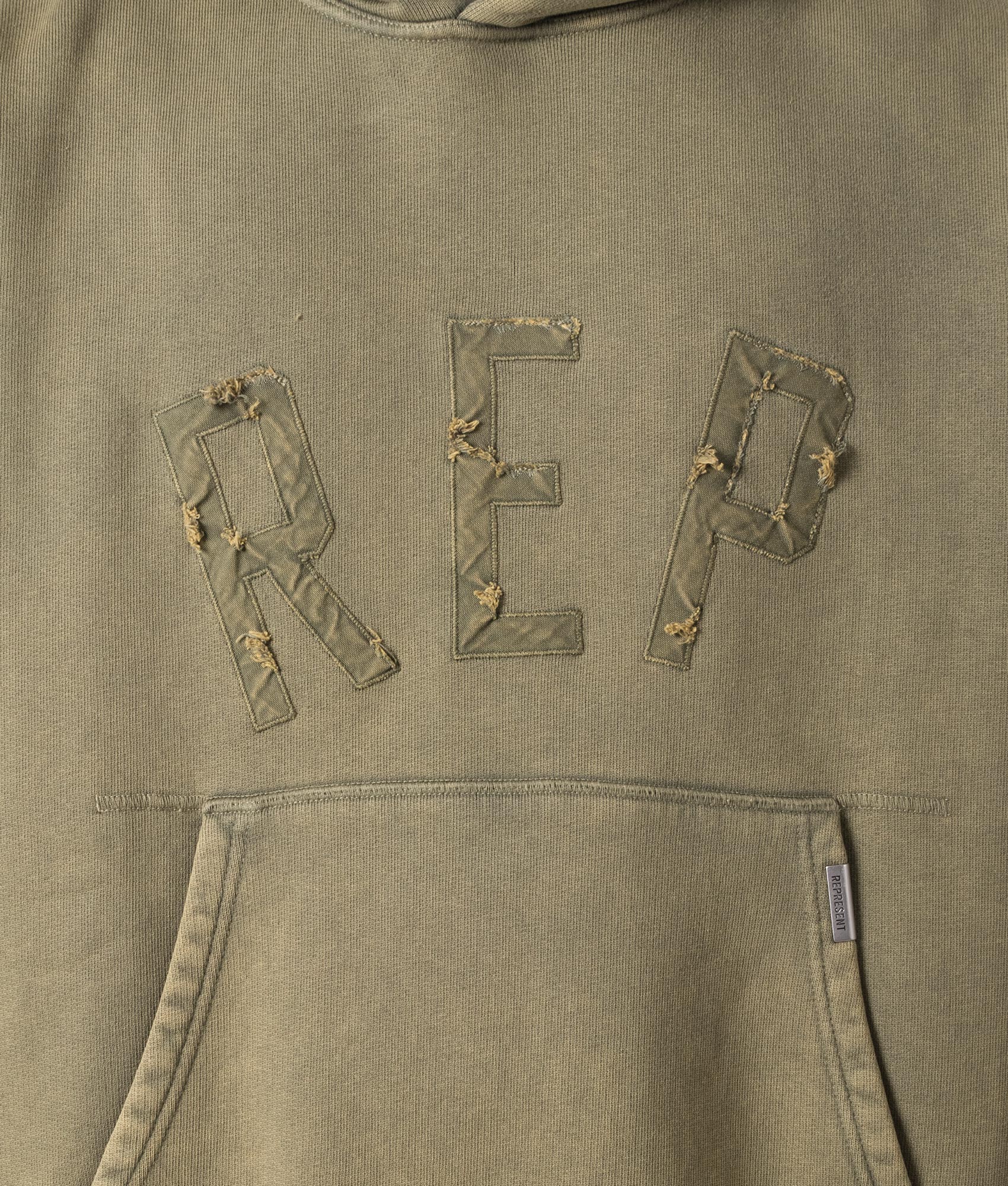 Rep Applique Hoodie in Fawn by Represent. EQVVS Model Shot. 