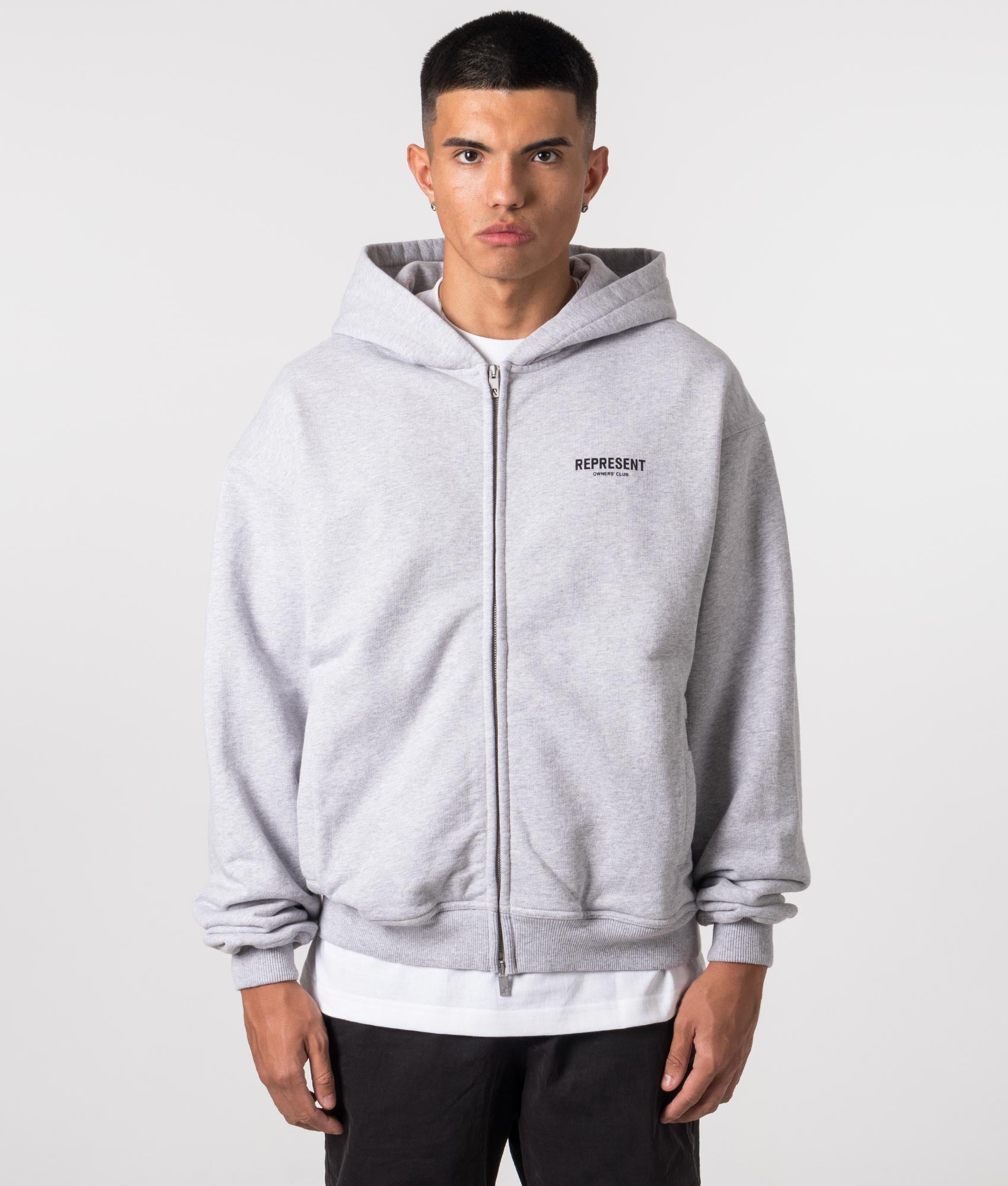 REPRESENT Owners Club Zip Through Hoodie in Ash Grey at EQVVS Menswear. Model front shot.