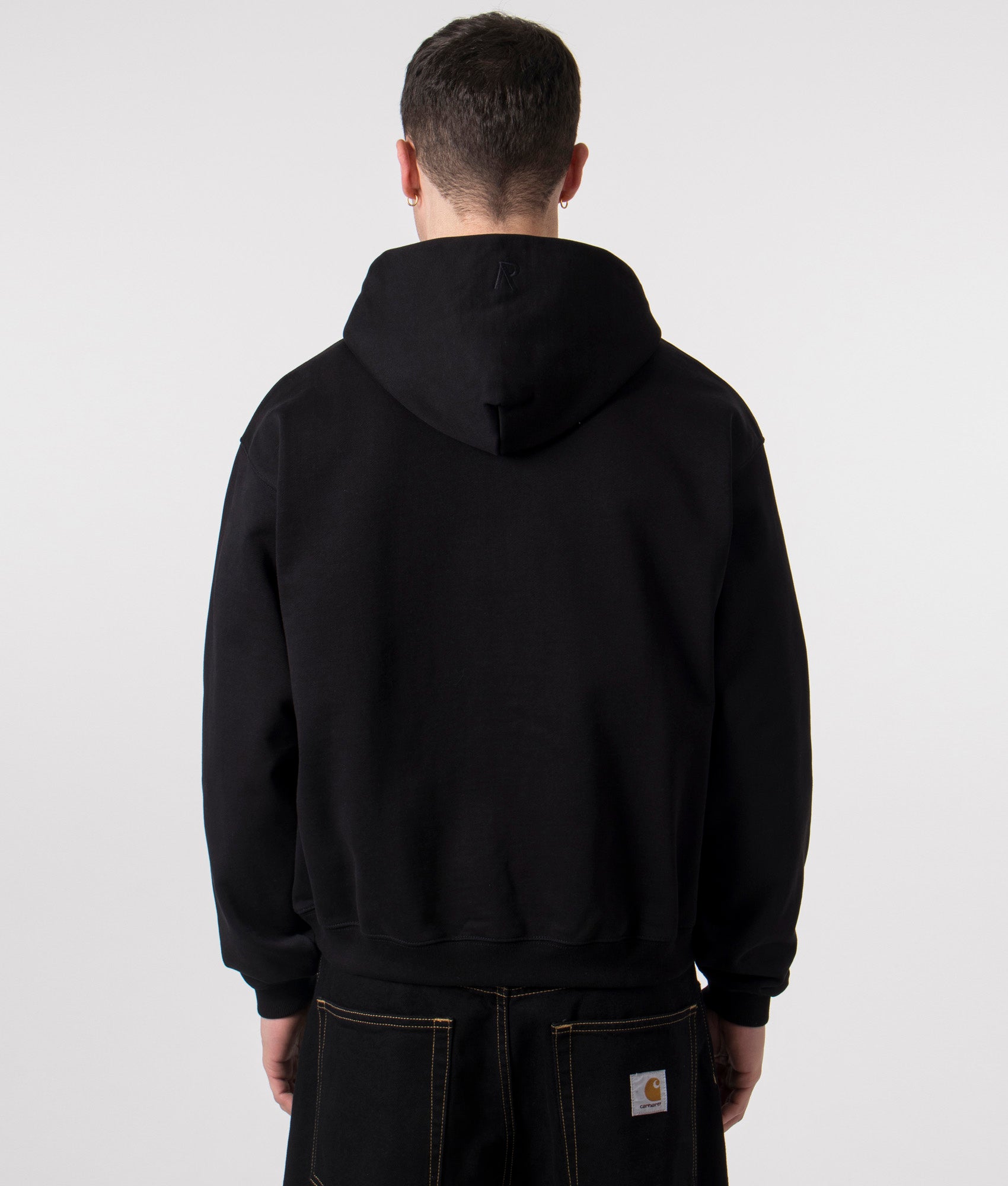 Initial Zip Through Hoodie in Black by REPRESENT. Shot at EQVVS. Reverse shot model. 
