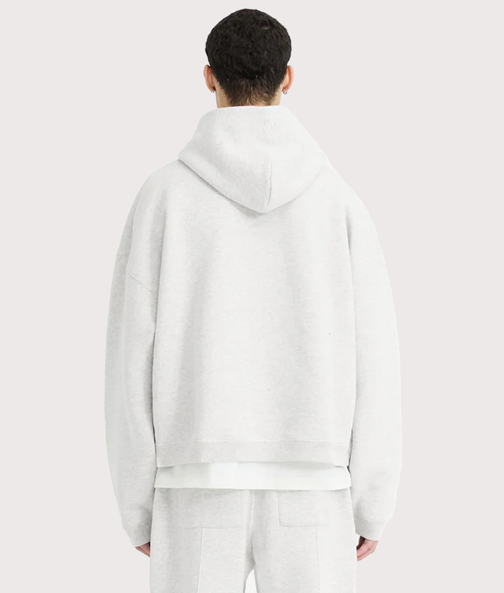 REPRESENT Oversized Initial Boxy Hoodie in Ice Grey Marl at EQVVS Menswear. Model back shot.