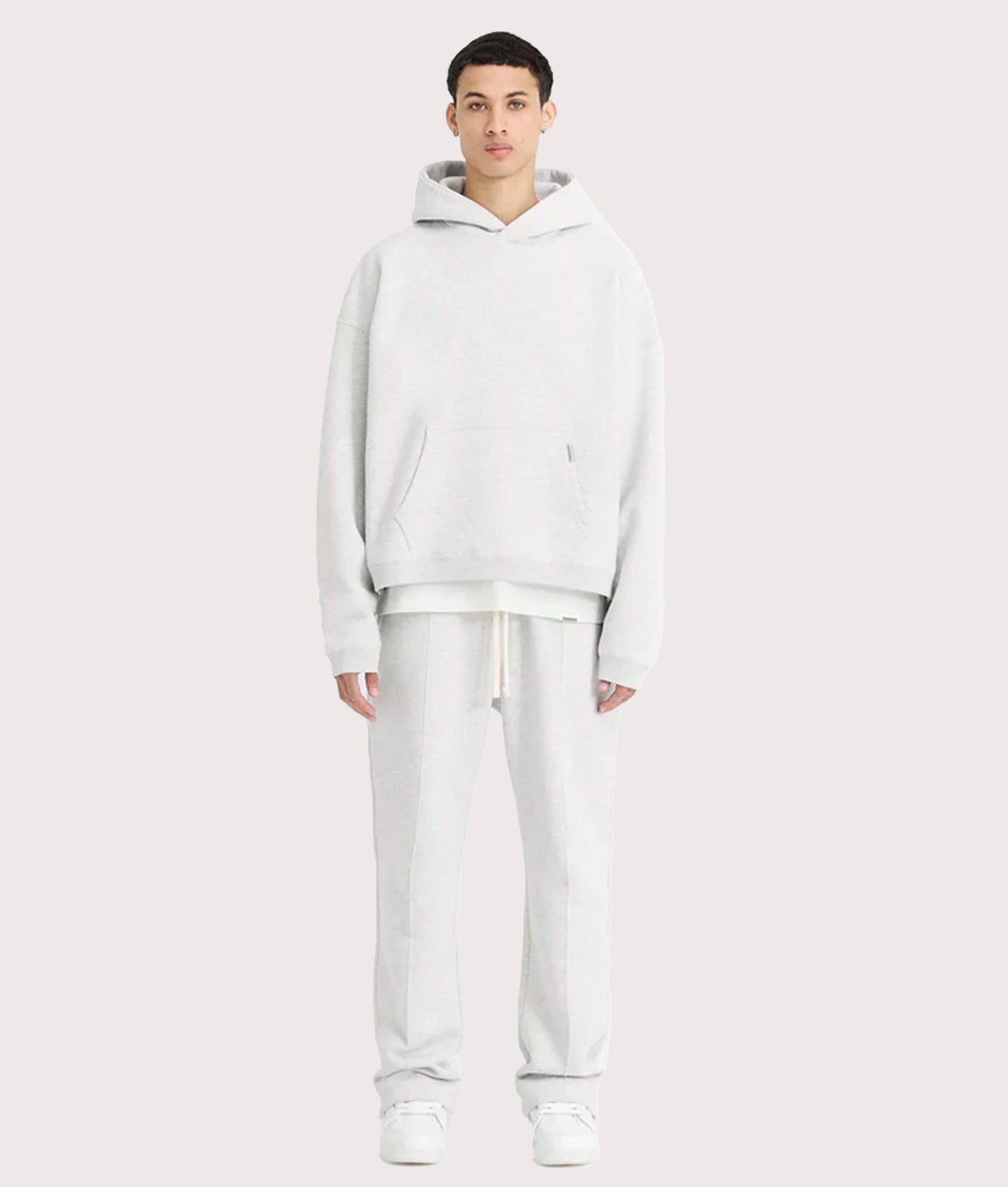 REPRESENT Oversized Initial Boxy Hoodie in Ice Grey Marl at EQVVS Menswear. Model full front shot.