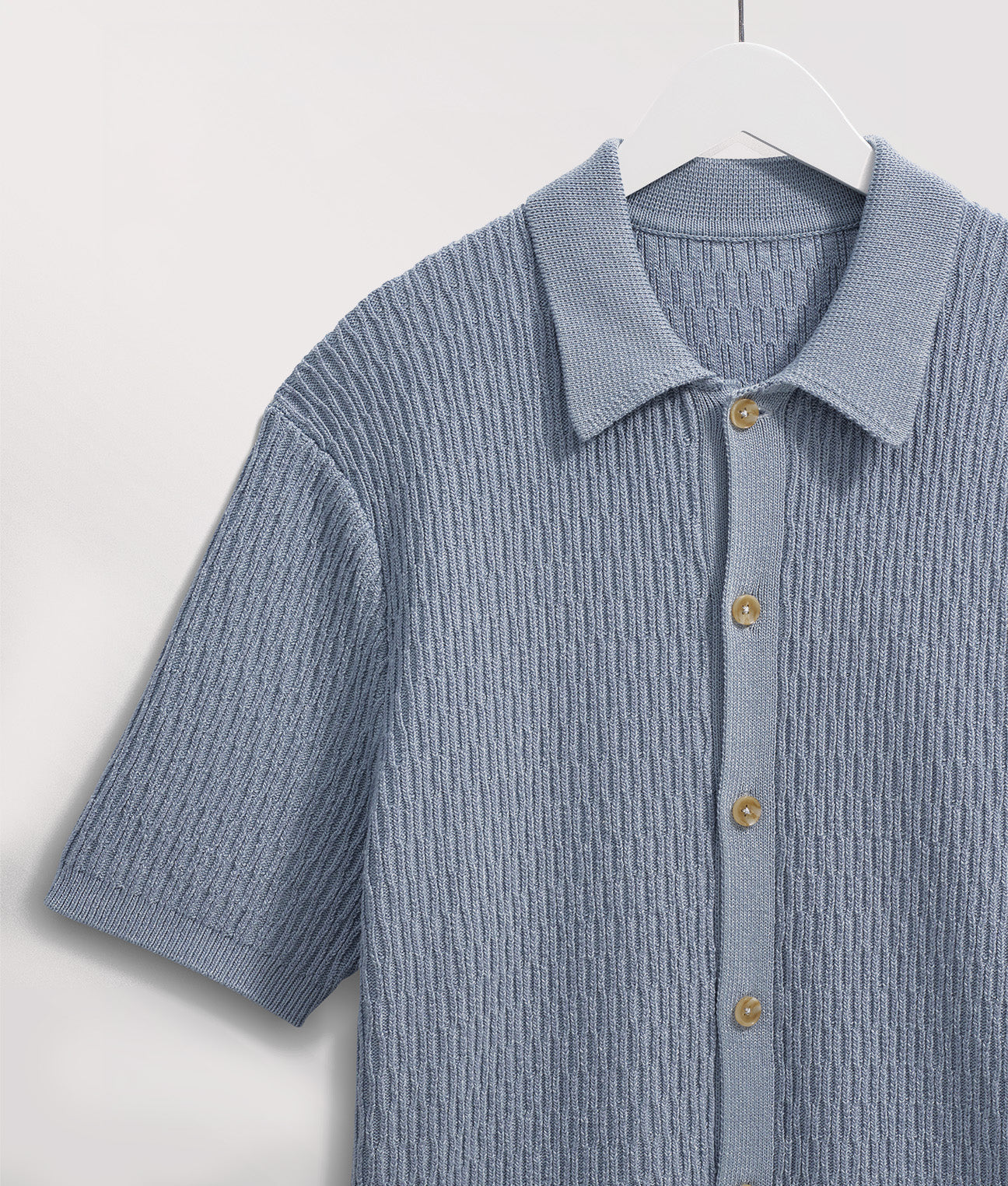 Wax London Tellaro Short Sleeve Shirtin Blue at EQVVS. Detail Shot Hanging.