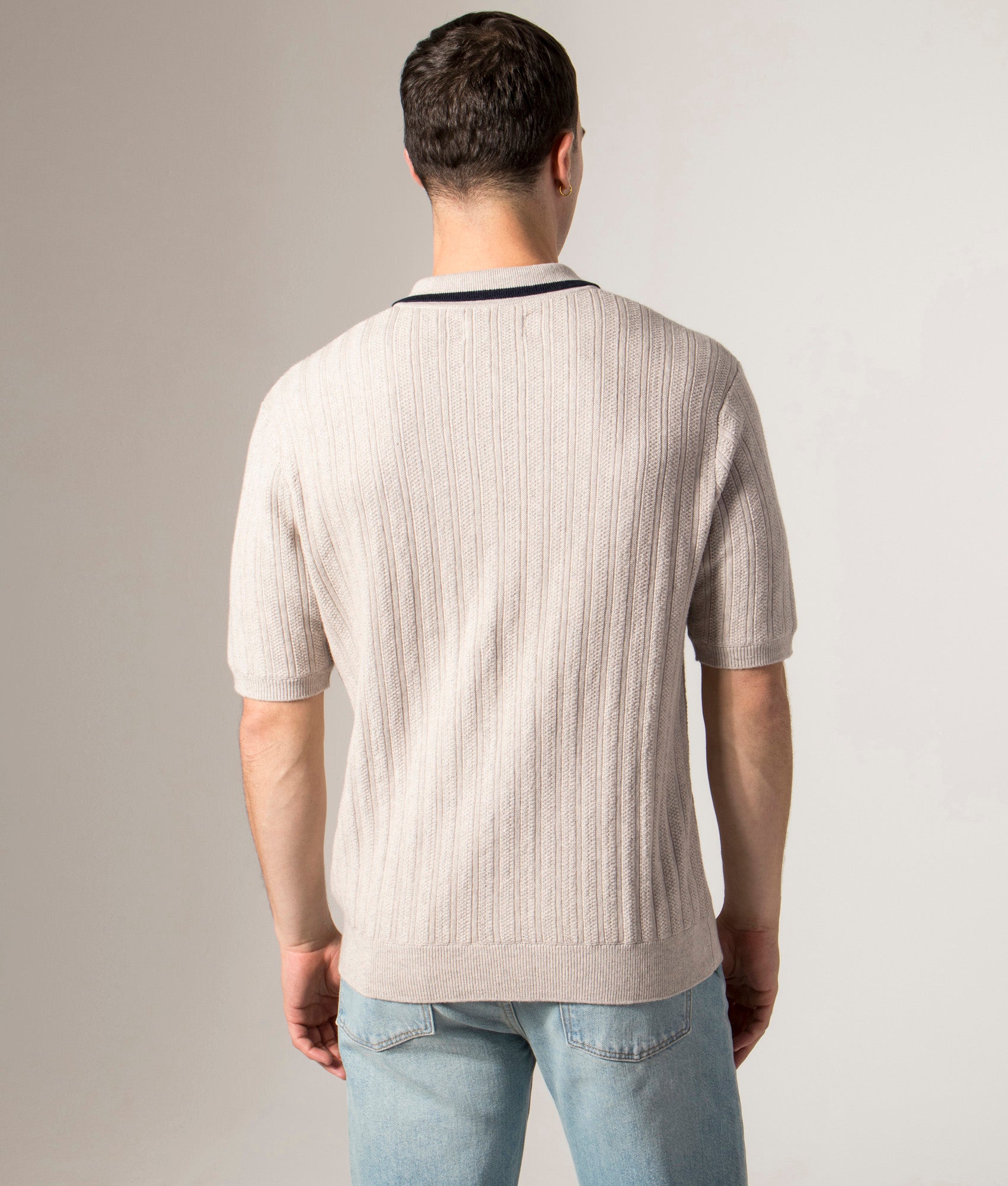 Bury Quarter Zip Knit Polo Shirt by Wax London in Natural Melange. Shot by EQVVS. Back model shot.