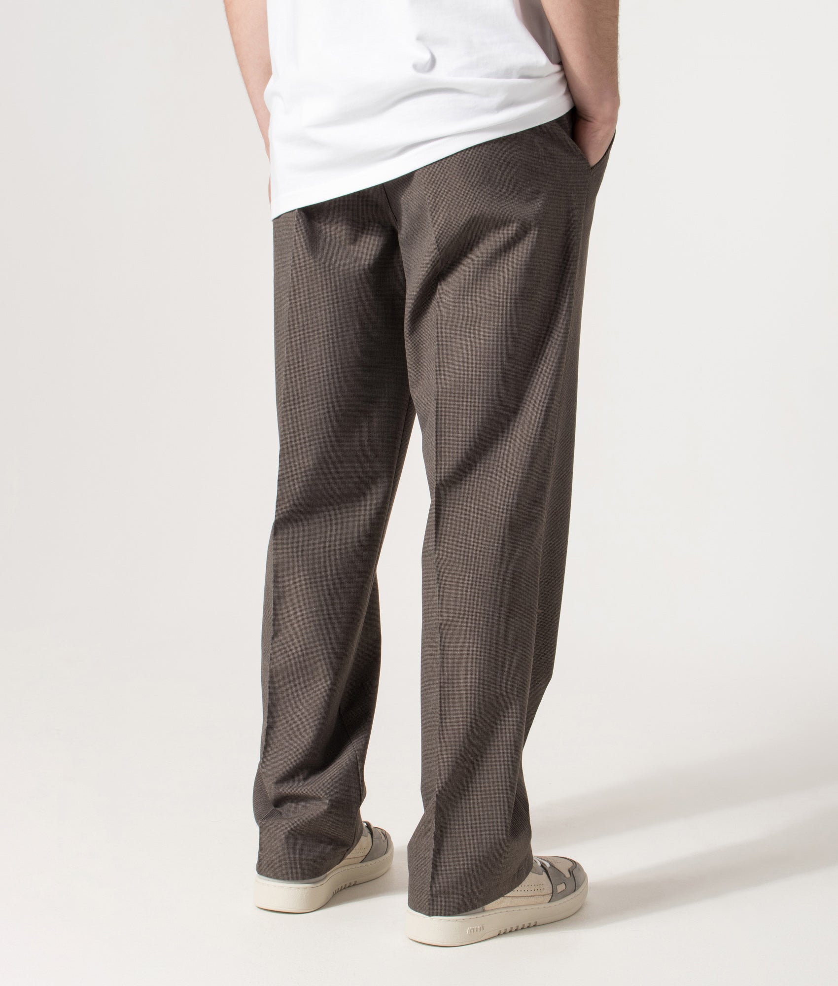 Wax London Bayham Trousers in Brown Micro Puppytooth at EQVVS Menswear. Angled back shot.