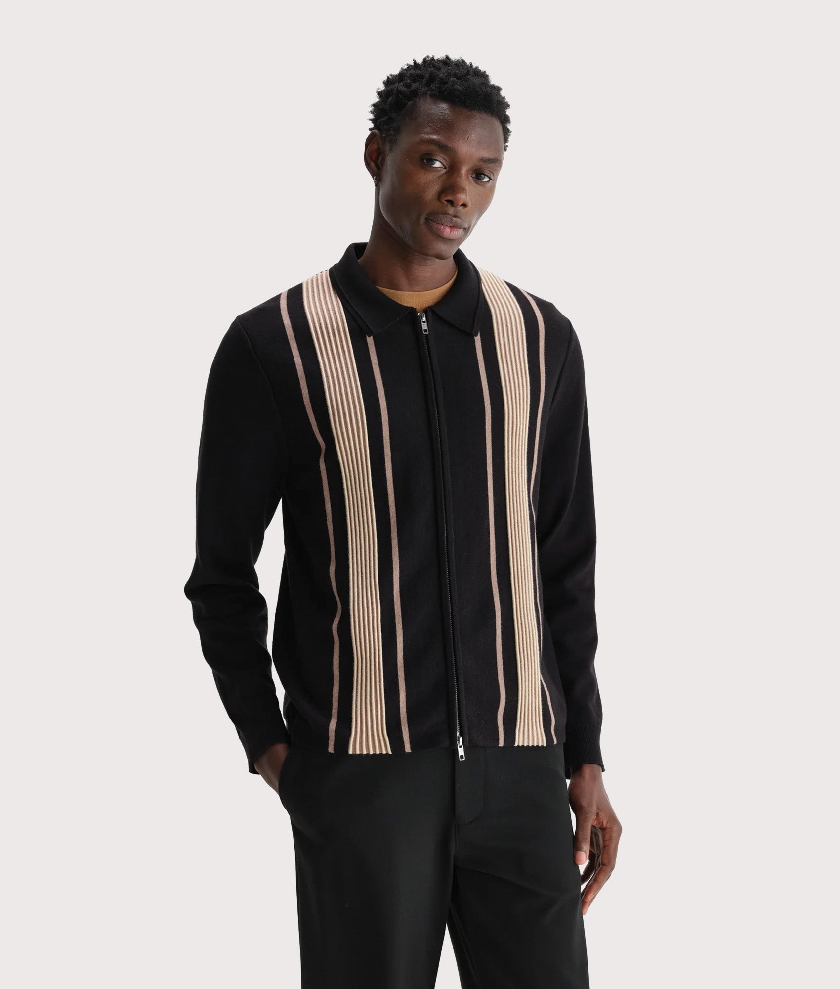 Wax London Lennox Polo Shirt in Black and Beige at EQVVS Menswear. Model front shot.