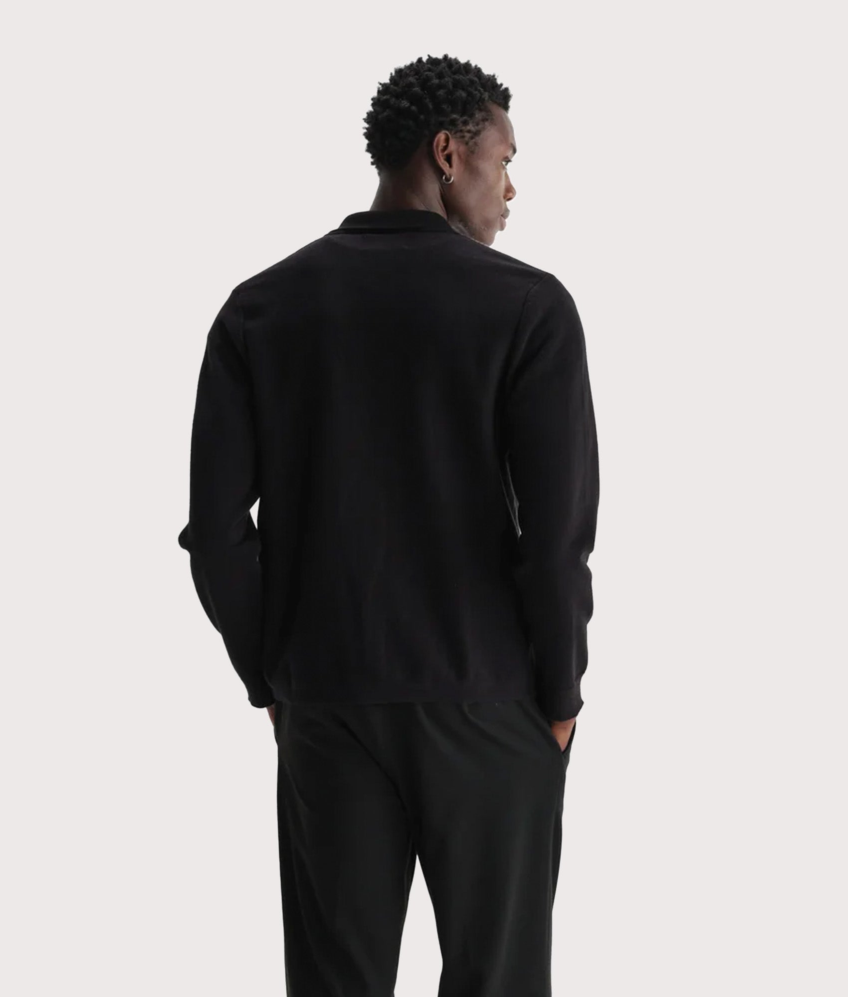 Wax London Lennox Polo Shirt in Black and Beige at EQVVS Menswear. Model back shot.