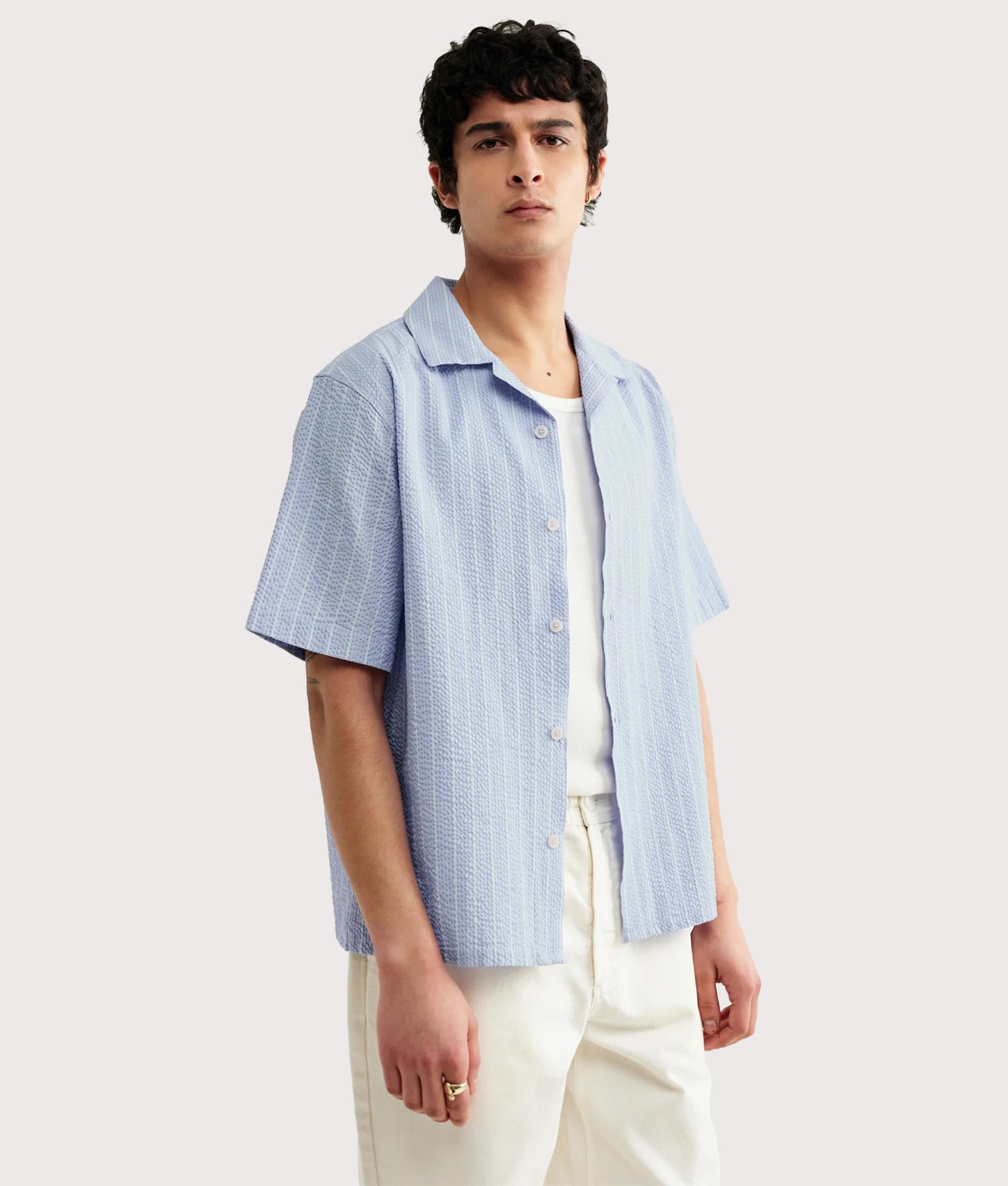 Wax London Didcot Seersucker Stripe Short Sleeve Shirt in Blue and Ecru at EQVVS Menswear. Model front shot.