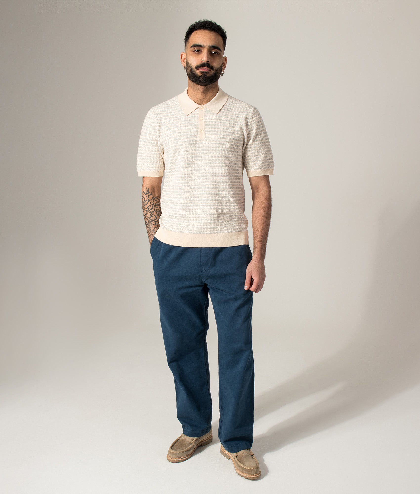Wax London Naples Mini Geo Polo Shirt in Natural at EQVVS Menswear. Model front shot.