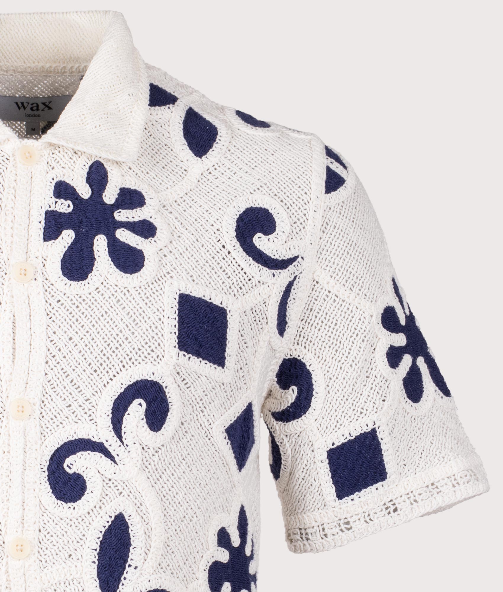 Wax London Porto Doodle Crochet Polo Shirt in Ecru/Dark Blue at EQVVS Menswear. Detail shot.