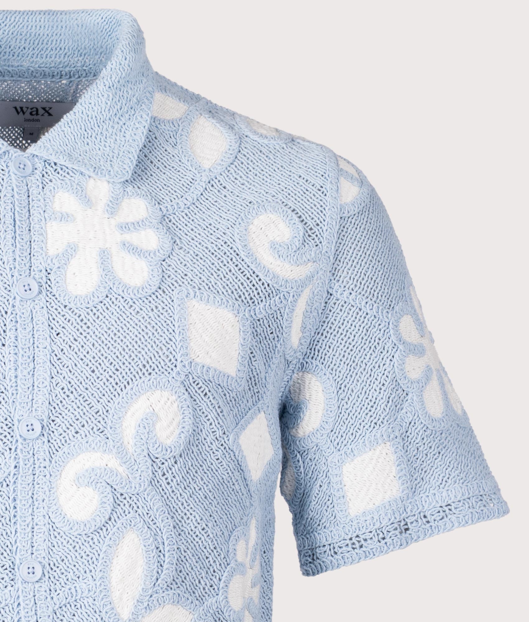 Wax London Porto Doodle Crochet Polo Shirt in Pale Blue and Ecru at EQVVS Menswear. Detail shot.