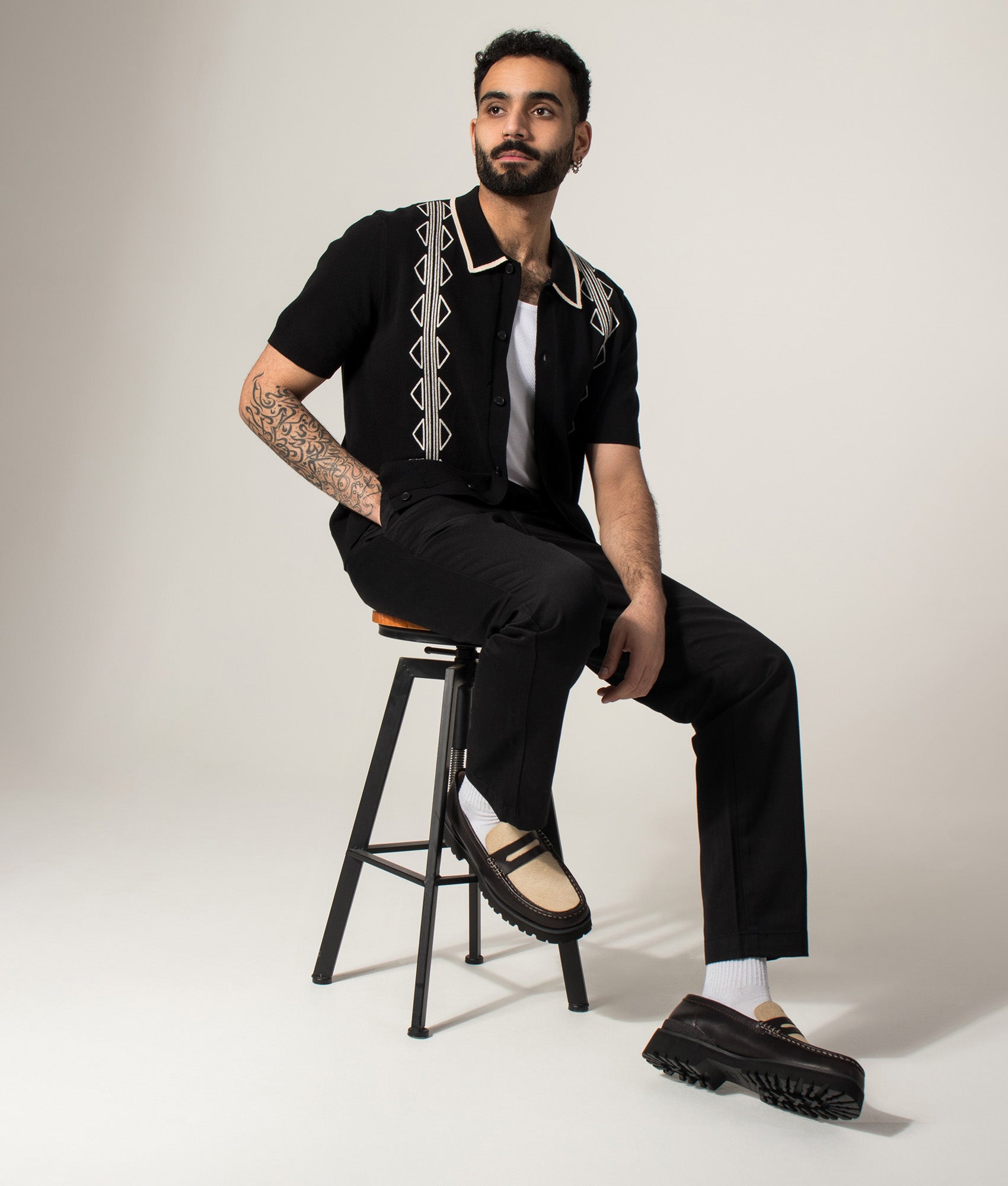 Tellaro Retro Embroidery Polo Shirt in Black/Ecru by Wax London. Shot by EQVVS. Model shot.